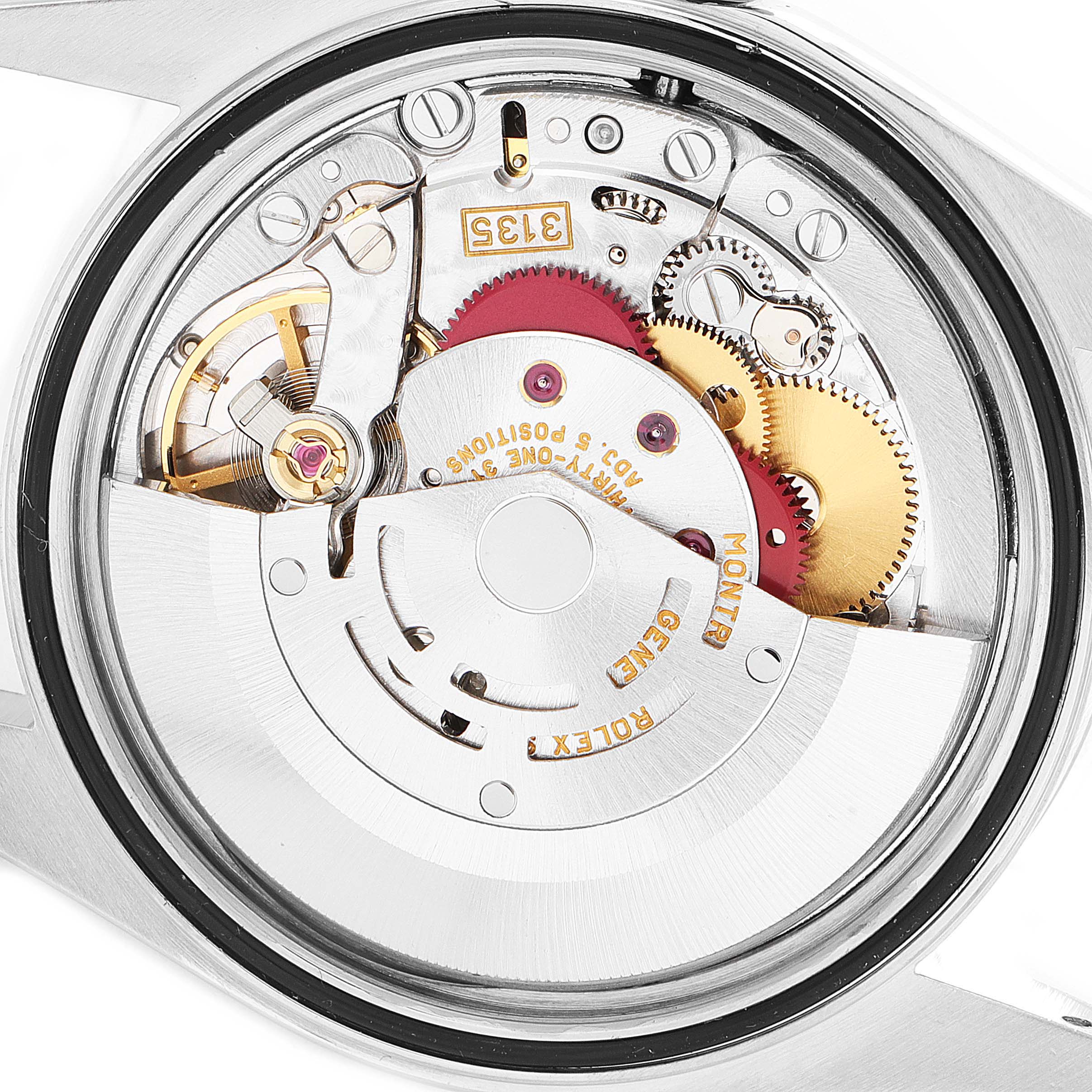 This is a close-up of the movement mechanism inside a Rolex Datejust 16220 Men's Stainless Steel Silver Dial 16220 Men's Stainless Steel Silver Dial watch, showing gears and springs.