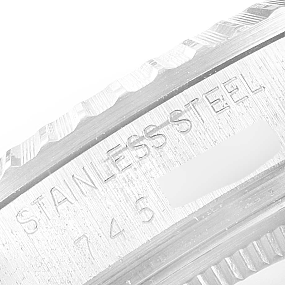 This close-up image shows the engraved stainless steel bezel of a Rolex Vintage Collection 16030 Men's Stainless Steel Silver Dial 16030 Men's Stainless Steel Silver Dial watch.