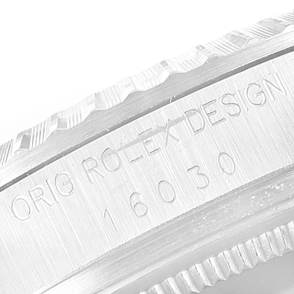 This image shows a close-up, angled view of the engraved bezel and inside case of the Vintage Collection Rolex model 16030.