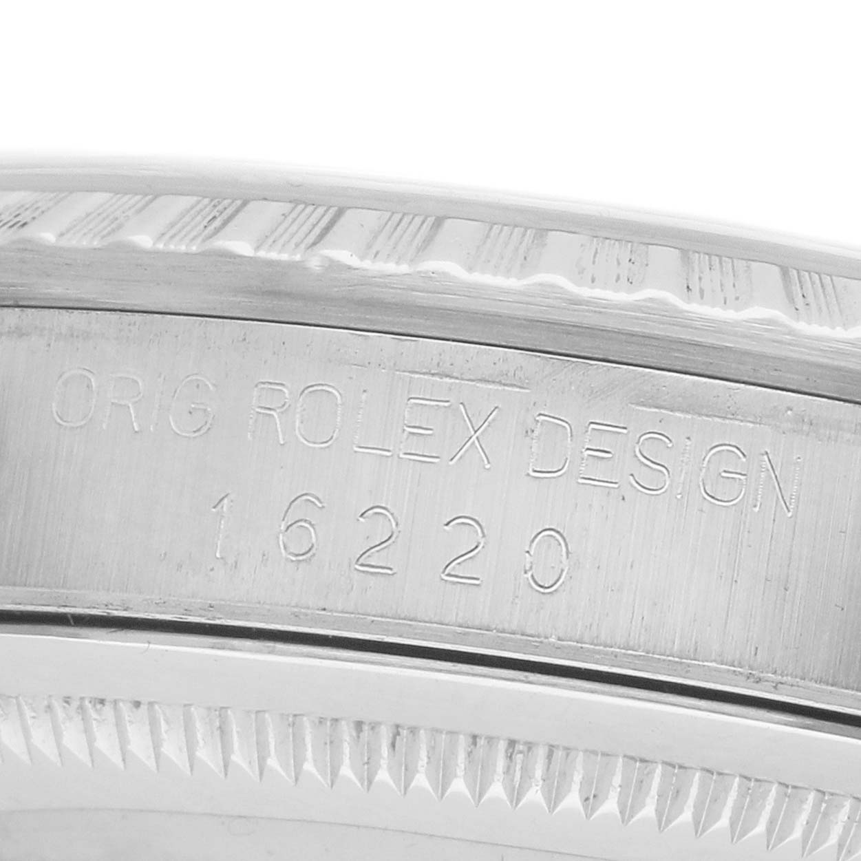 The image shows a close-up of the engraved case side of a Rolex Datejust 16220 Men's Stainless Steel Beige Dial, revealing the model number.