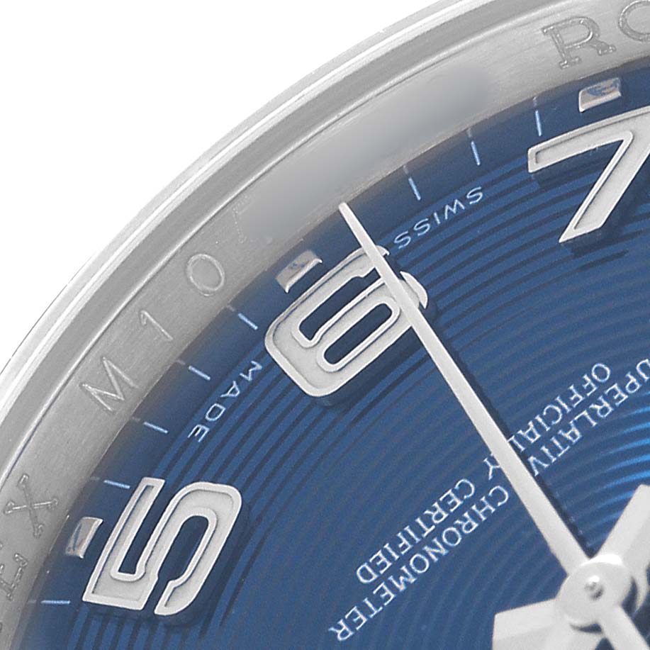The image shows a close-up of the Rolex Datejust 116200 Men's Stainless Steel Blue Dial watch's blue dial, displaying hour markers, part of the bezel, and hands.