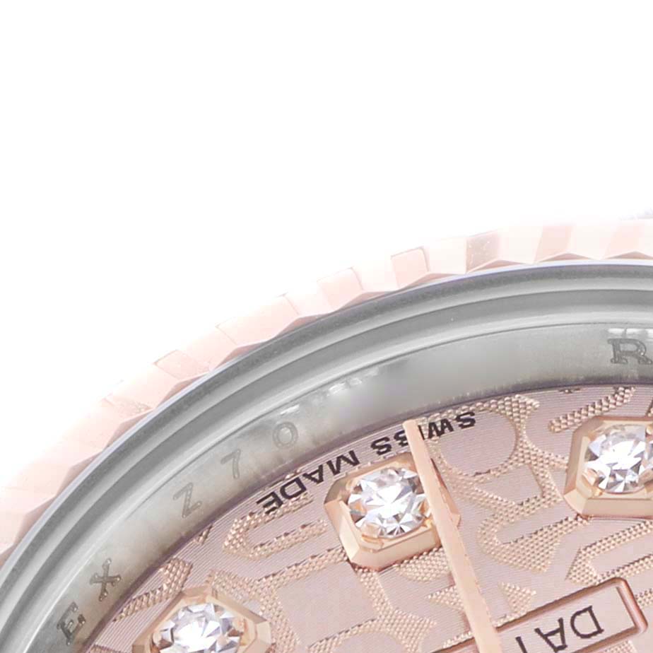The image shows a close-up of the dial and the bezel of a Rolex Datejust 179171 Women's Steel and Gold (two tone) Pink Dial, highlighting diamond markers and part of the fluted bezel.