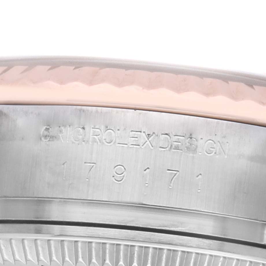 The image shows a close-up of the side of a Rolex Datejust 179171 Women's Steel and Gold (two tone) Pink Dial watch, highlighting the engraved "ORIG ROLEX DESIGN" and a serial number.