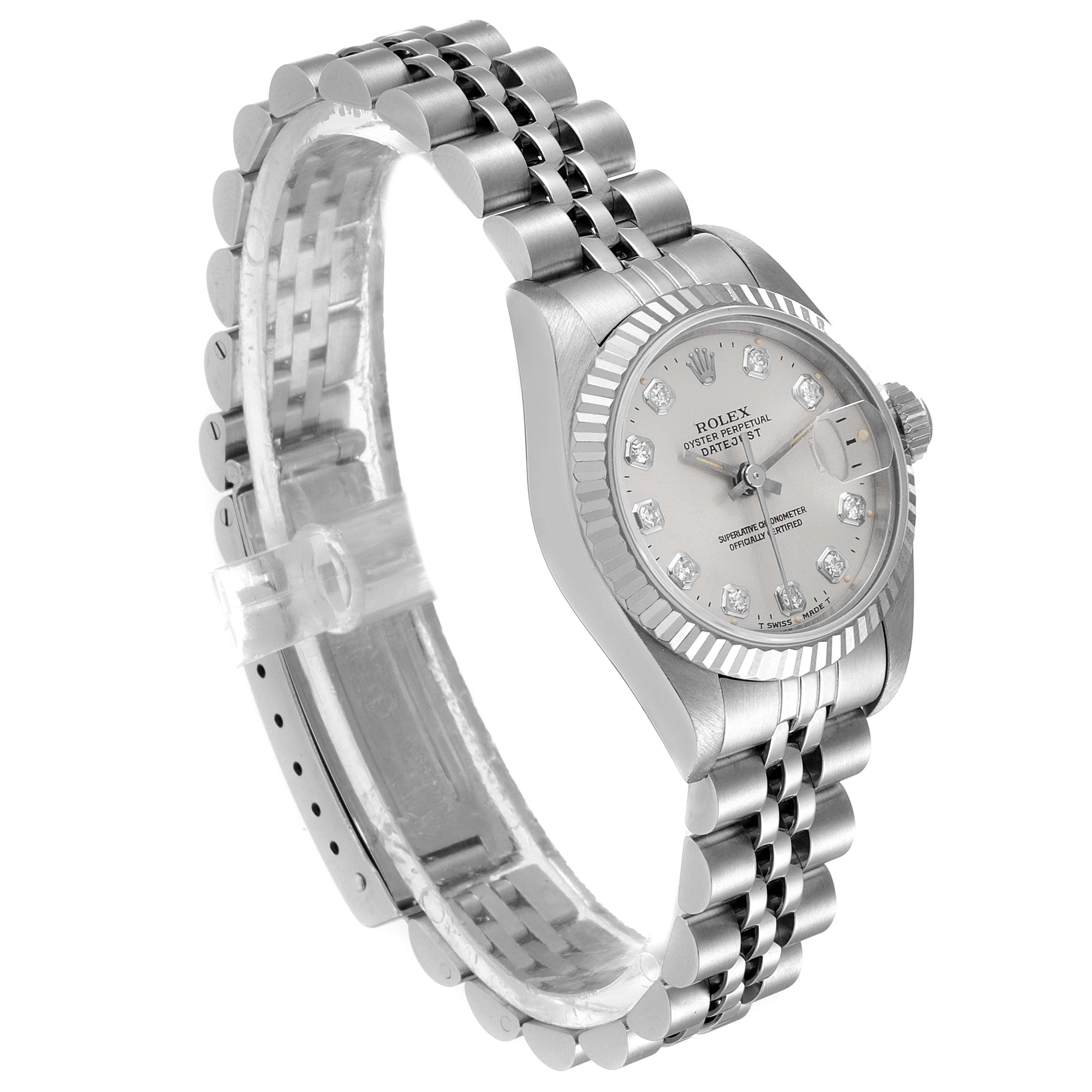 The Rolex Datejust 69174 Women's Stainless Steel Silver Dial 69174 Women's Stainless Steel Silver Dial model watch is shown at an oblique angle, highlighting its silver dial, diamond hour markers, fluted bezel, and jubilee bracelet.