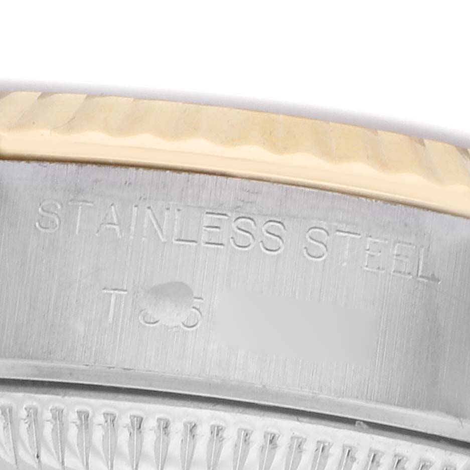 The image shows the side of a Rolex Datejust 69173 Women's Steel and Gold (two tone) Champagne Dial watch case with "Stainless Steel" engraving.