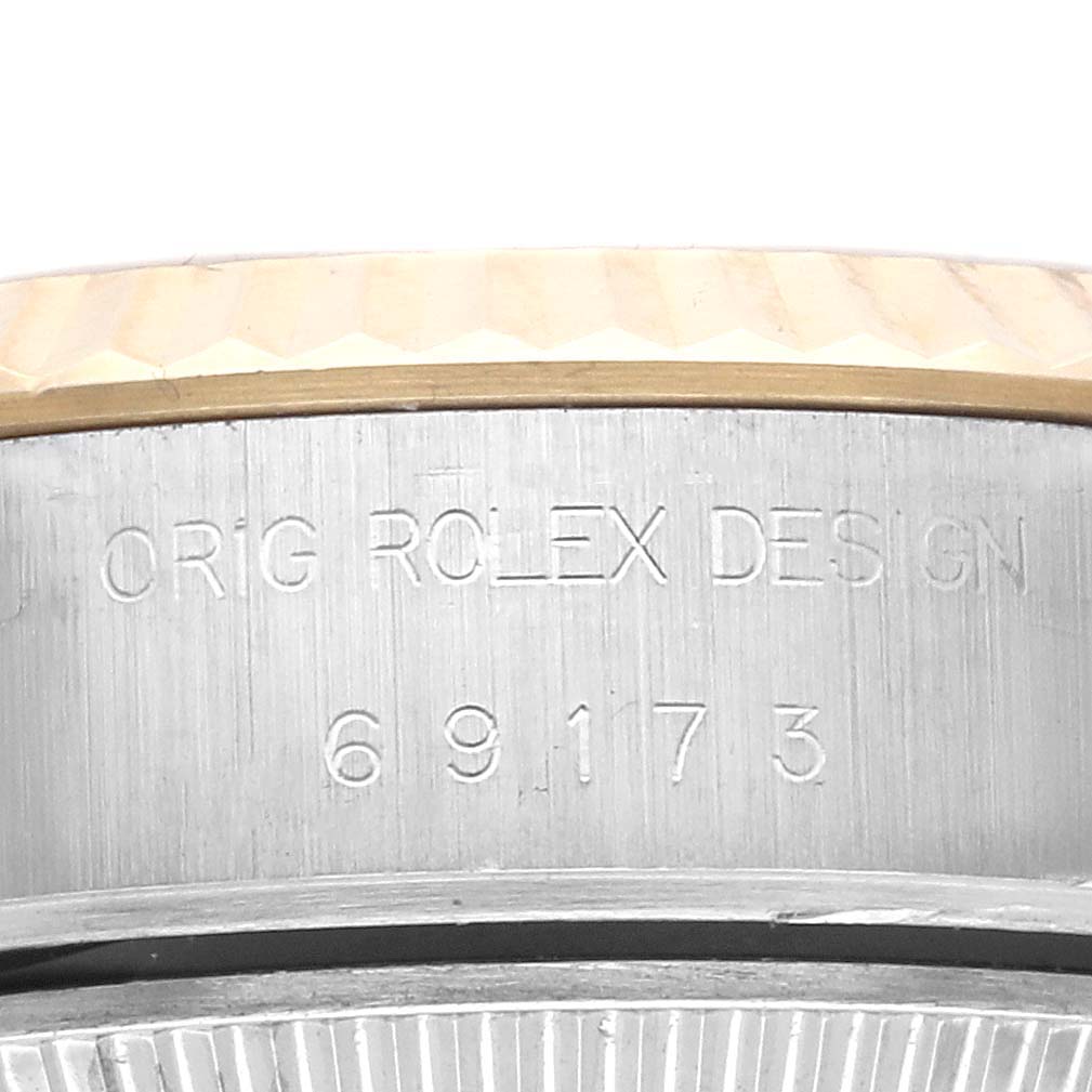 The image shows the side engraving on a Rolex Datejust 69173 Women's Steel and Gold (two tone) Champagne Dial 69173 Women's Steel and Gold (two tone) Champagne Dial watch case.