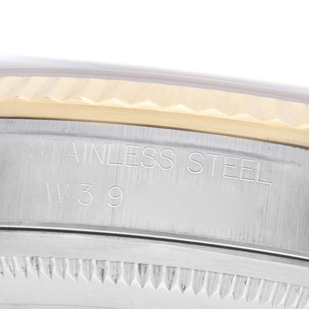 The image shows a close-up of the Rolex Datejust 16233 Men's Steel and Gold (two tone) White Dial bezel with "STAINLESS STEEL" engraving.