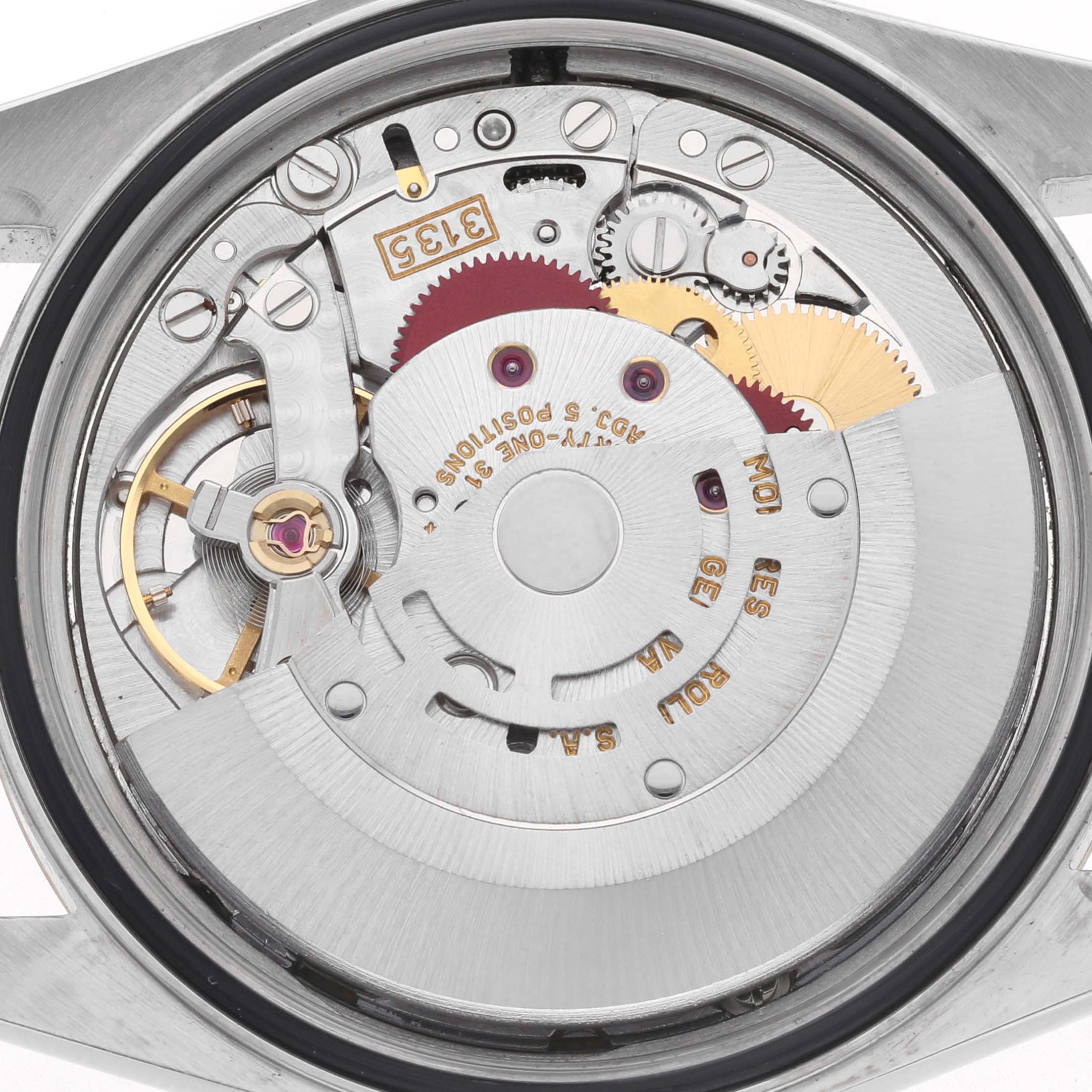 The image shows the intricate movement mechanism of a Rolex Datejust 16233 Men's Steel and Gold (two tone) White Dial watch viewed from the back.