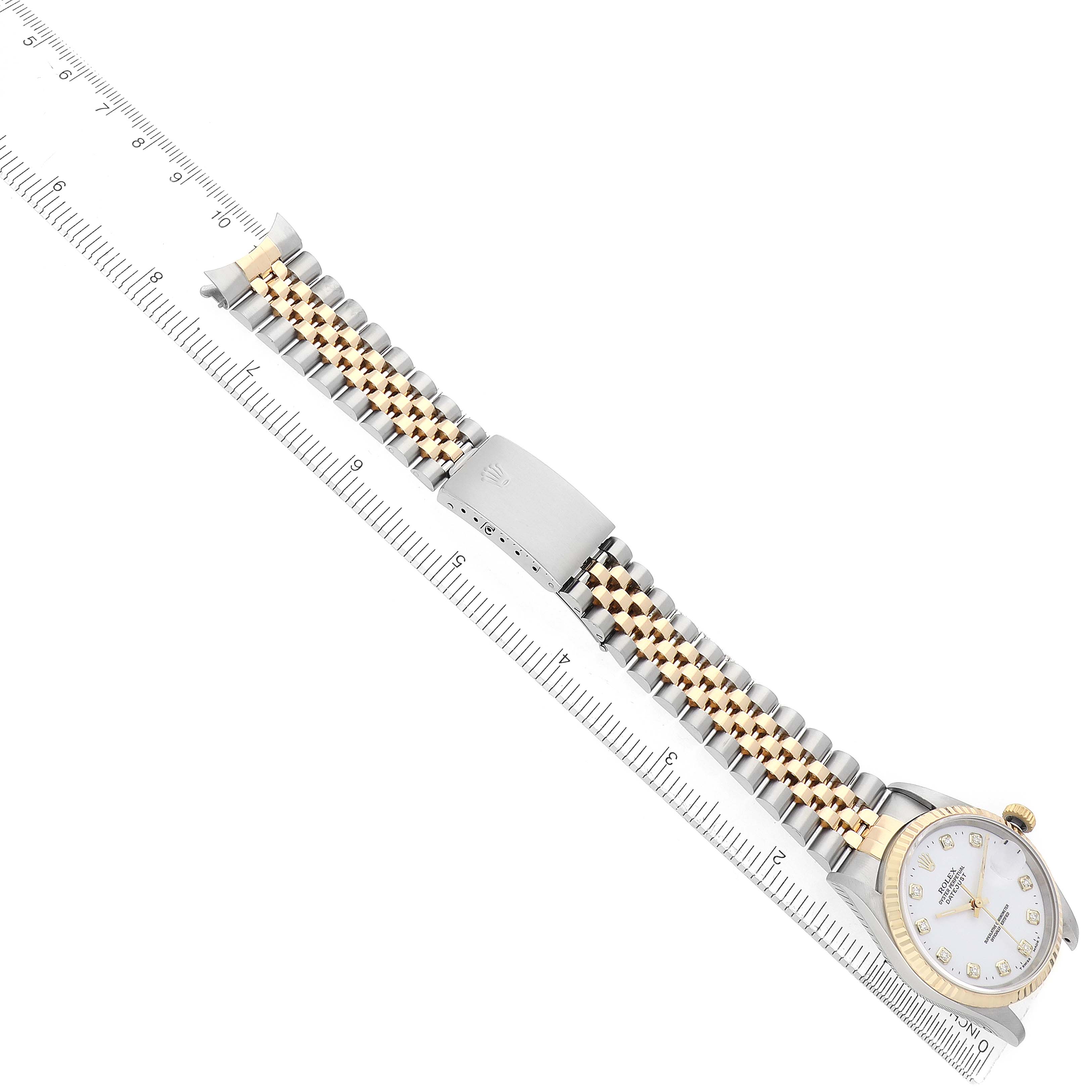 The image shows a Rolex Datejust 16233 Men's Steel and Gold (two tone) White Dial watch from a top-down angle, highlighting its bracelet, clasp, and partially visible dial.