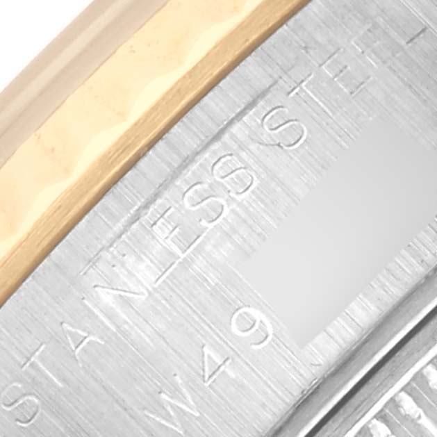 The image shows a close-up of the Rolex Datejust 69173 Women's Steel and Gold (two tone) Blue Dial 69173 Women's Steel and Gold (two tone) Blue Dial watch's stainless steel and gold case edge with engraved lettering.