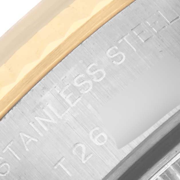 The image shows the side engraving and part of the bezel of a Rolex Datejust 69173 Women's Steel and Gold (two tone) Blue Dial 69173 Women's Steel and Gold (two tone) Blue Dial watch.