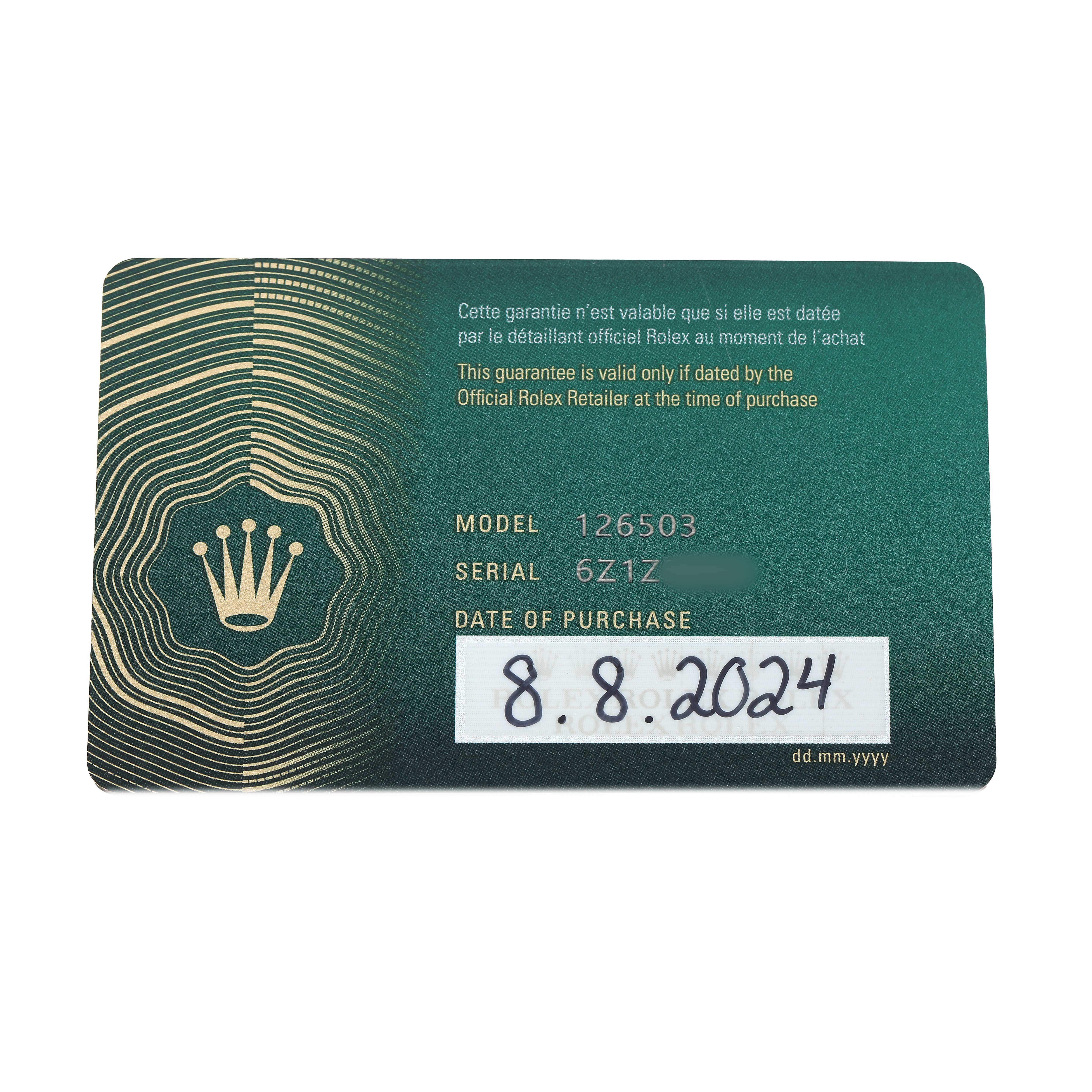 The image shows a close-up of a green Rolex warranty card for the Daytona model, displaying model, serial number, and purchase date.