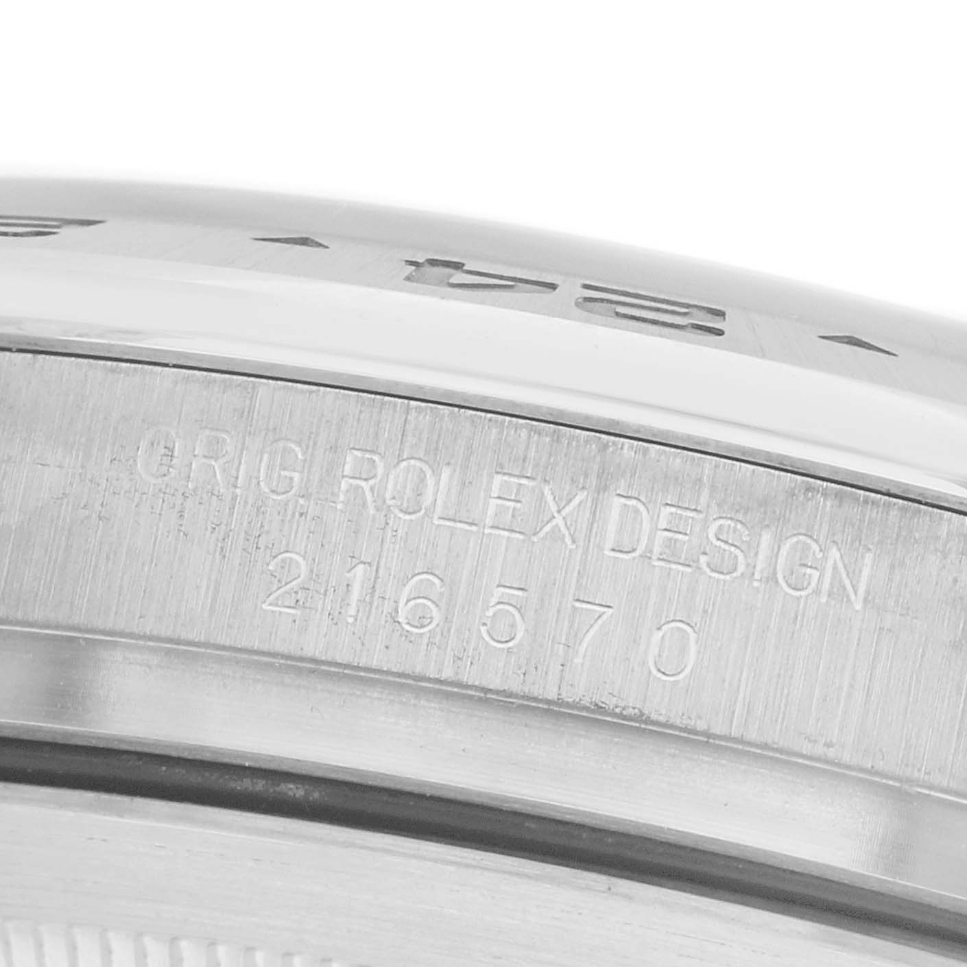 The image shows the side of a Rolex Explorer 216570 Men's Stainless Steel White Dial watch focusing on the engraved model number, "216570."