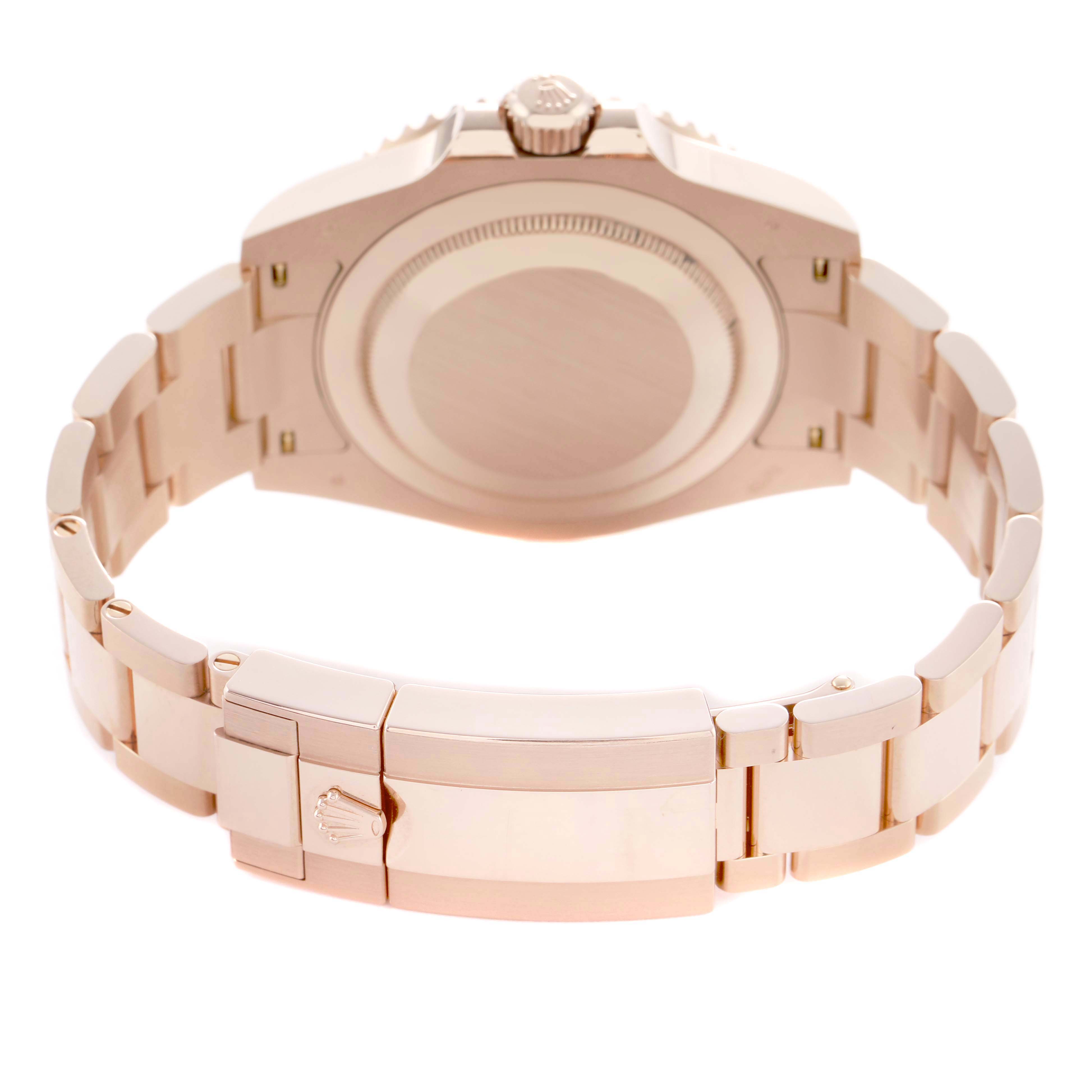 The image shows the back view of a Rolex GMT-Master 126715 Men's Rose Gold Black Dial, highlighting the watch case and bracelet clasp.