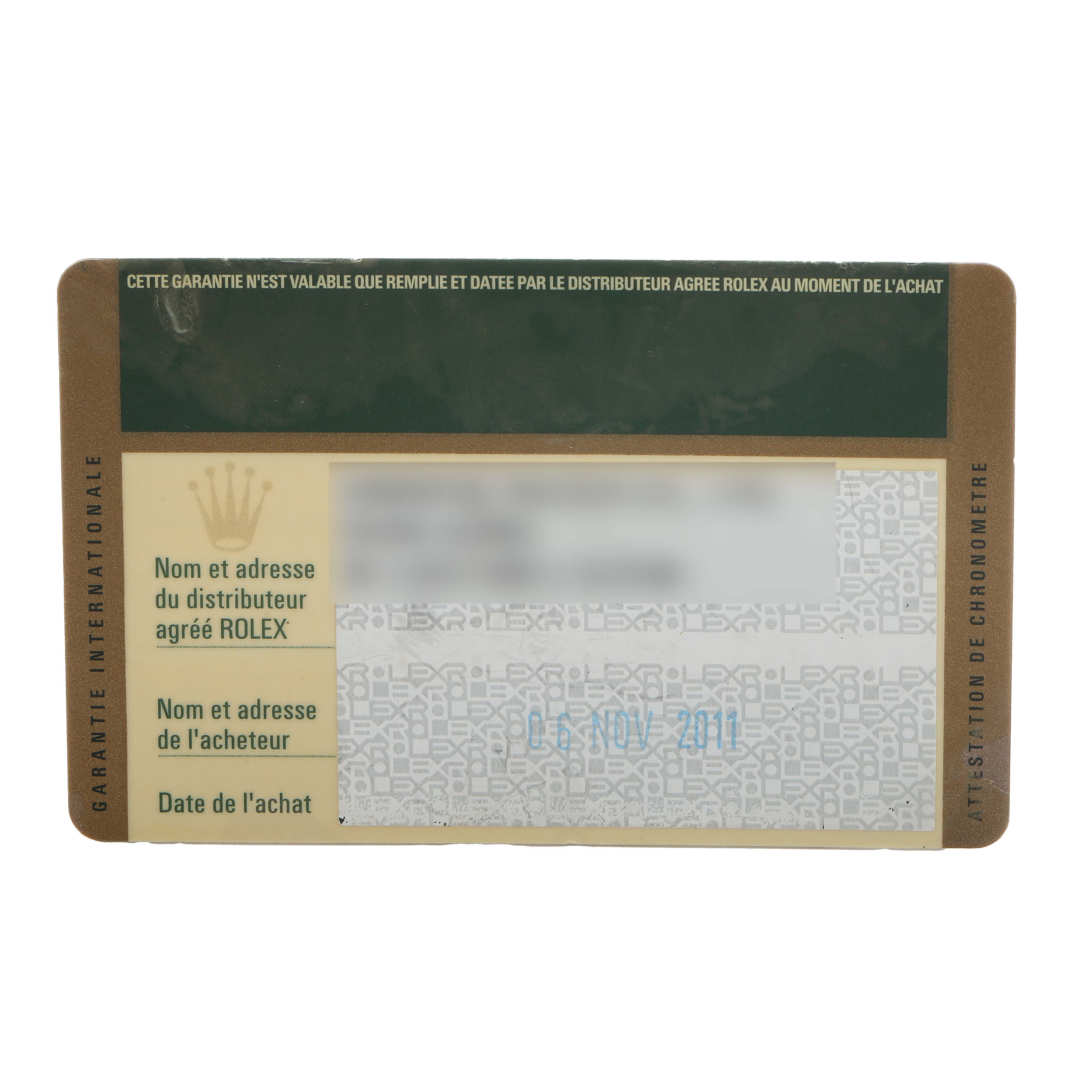 This image shows a Rolex warranty card with details blurred, for a GMT-Master model.