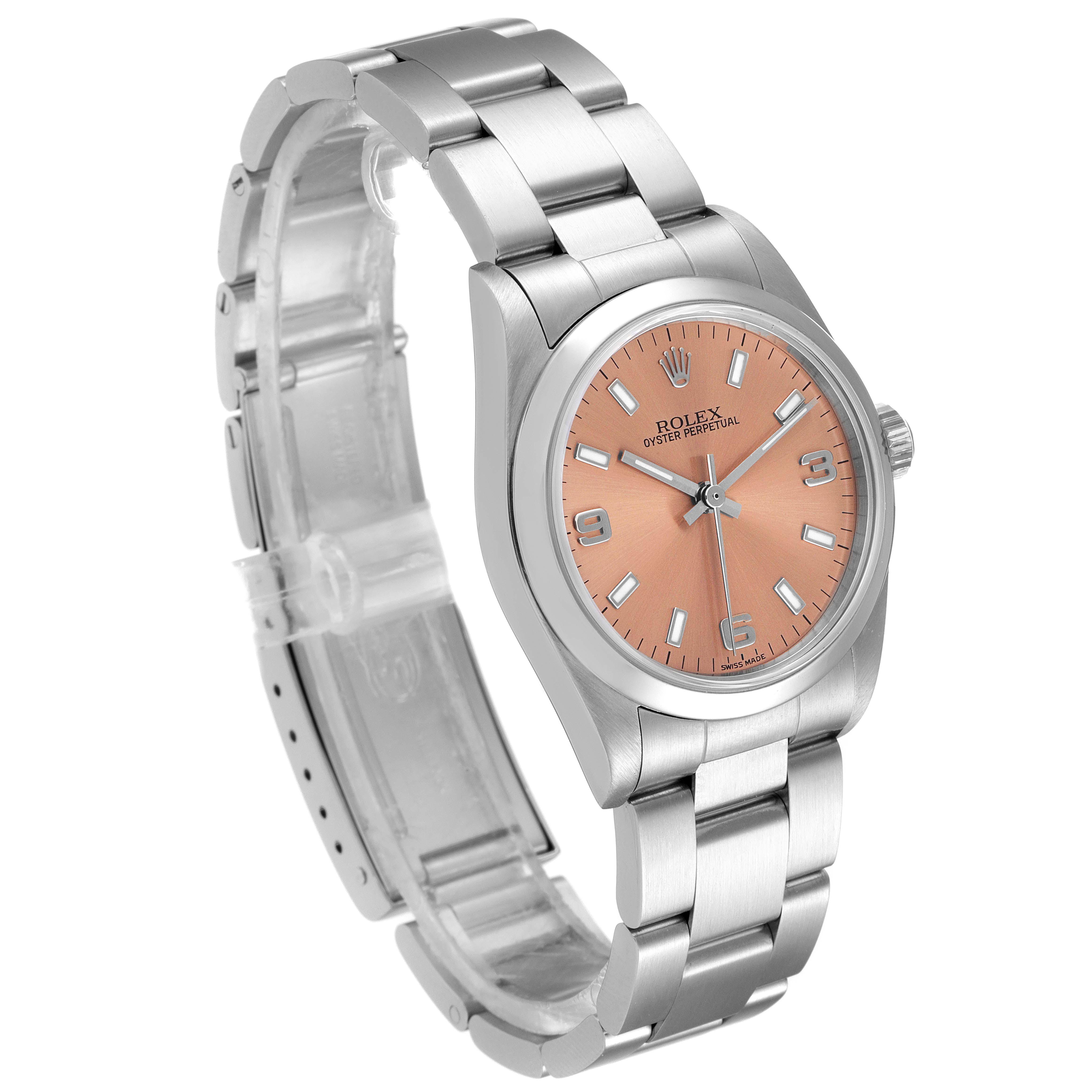 The Rolex Mid-Size 77080 Women
s Stainless Steel Pink Dial 77080 Women
s Stainless Steel Pink Dial watch is shown at a three-quarter angle, featuring its round dial, case, and stainless-steel bracelet.