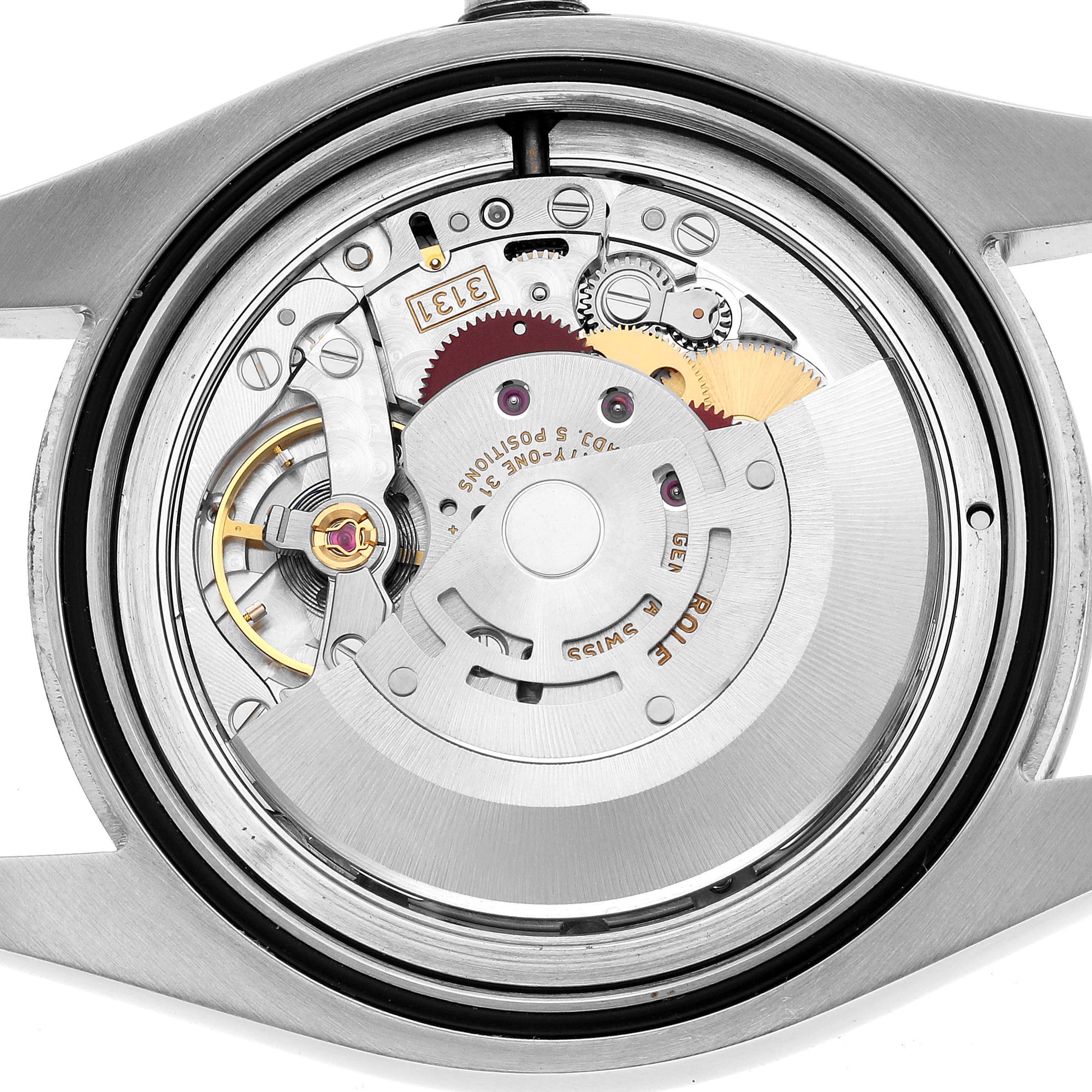 This image shows the movement of a Rolex Milgauss 116400GV Men's Stainless Steel Blue Dial watch from the back with its intricate gears and components visible.