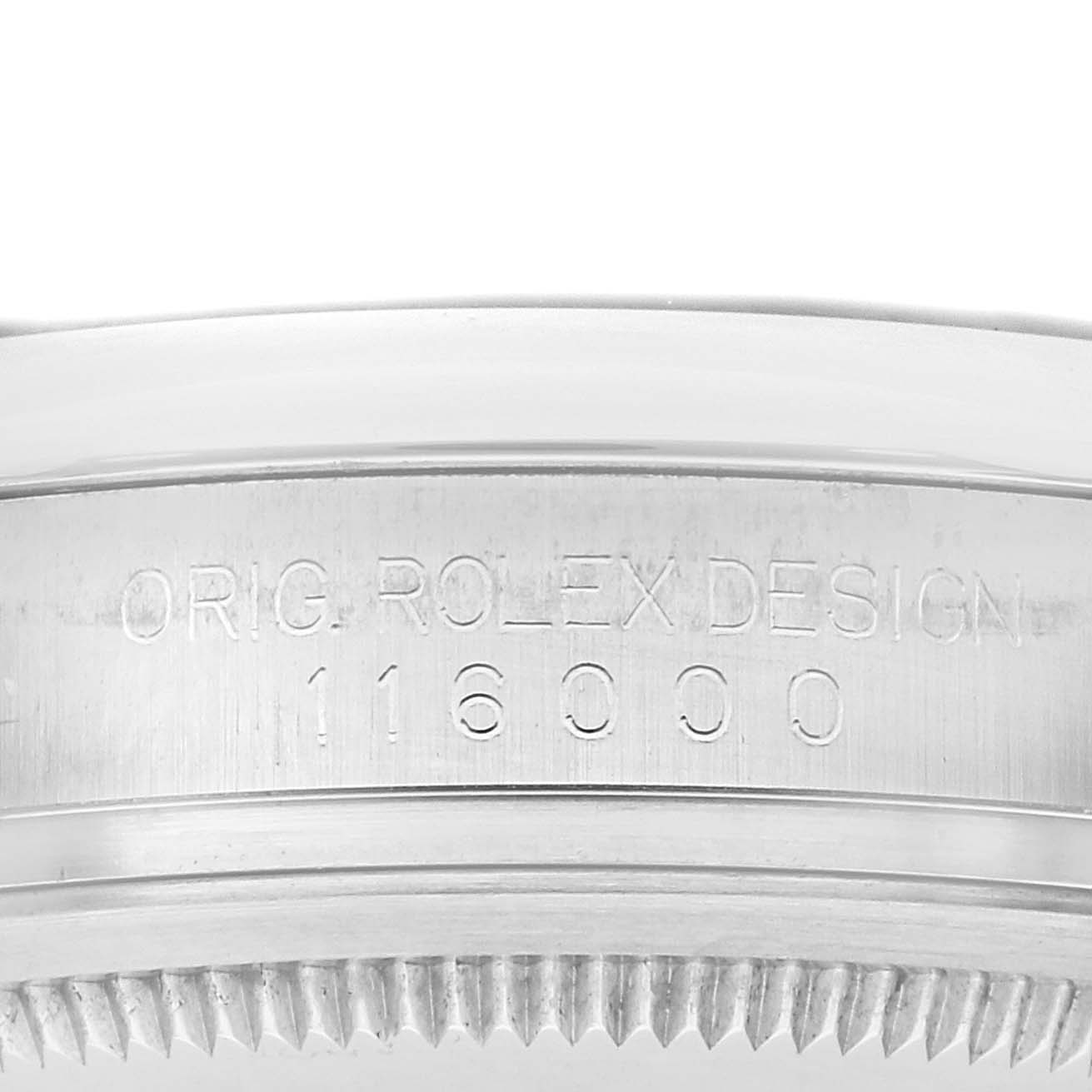 The image shows the side view of a Rolex Oyster Perpetual 116000 Men's Stainless Steel Black Dial case, featuring engraved text and the serial number.