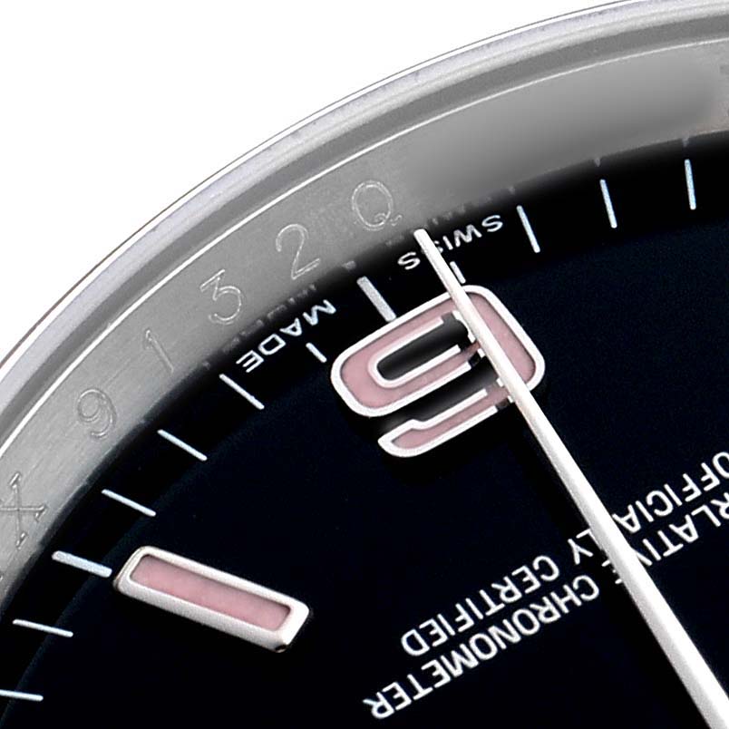 The image shows a close-up of the Rolex Oyster Perpetual 116000 Men's Stainless Steel Black Dial watch, highlighting the 3 o'clock position, part of the dial, and the hands.