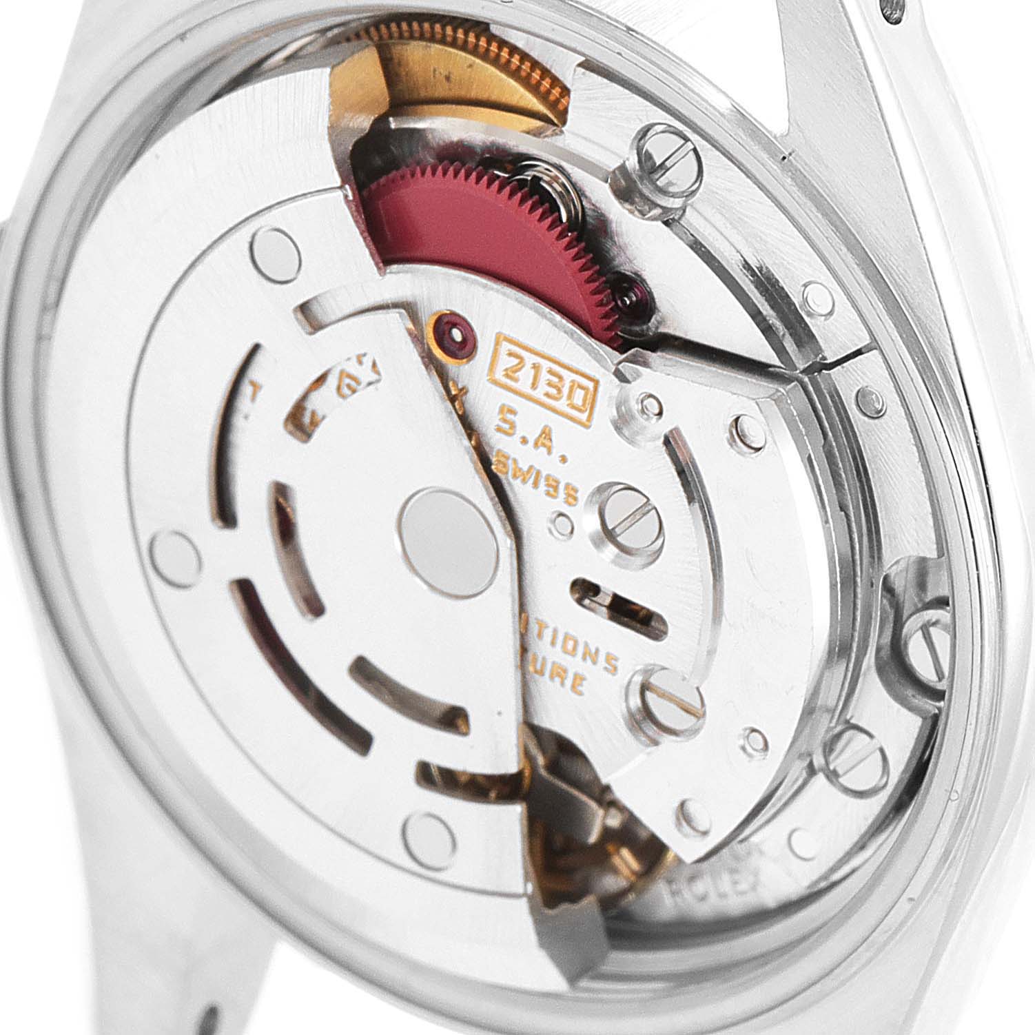 This image shows the internal mechanism of a Rolex Oyster Perpetual 67193 Women's Steel and Gold (two tone) Champagne Dial 67193 Women's Steel and Gold (two tone) Champagne Dial watch, featuring gears and movement parts.