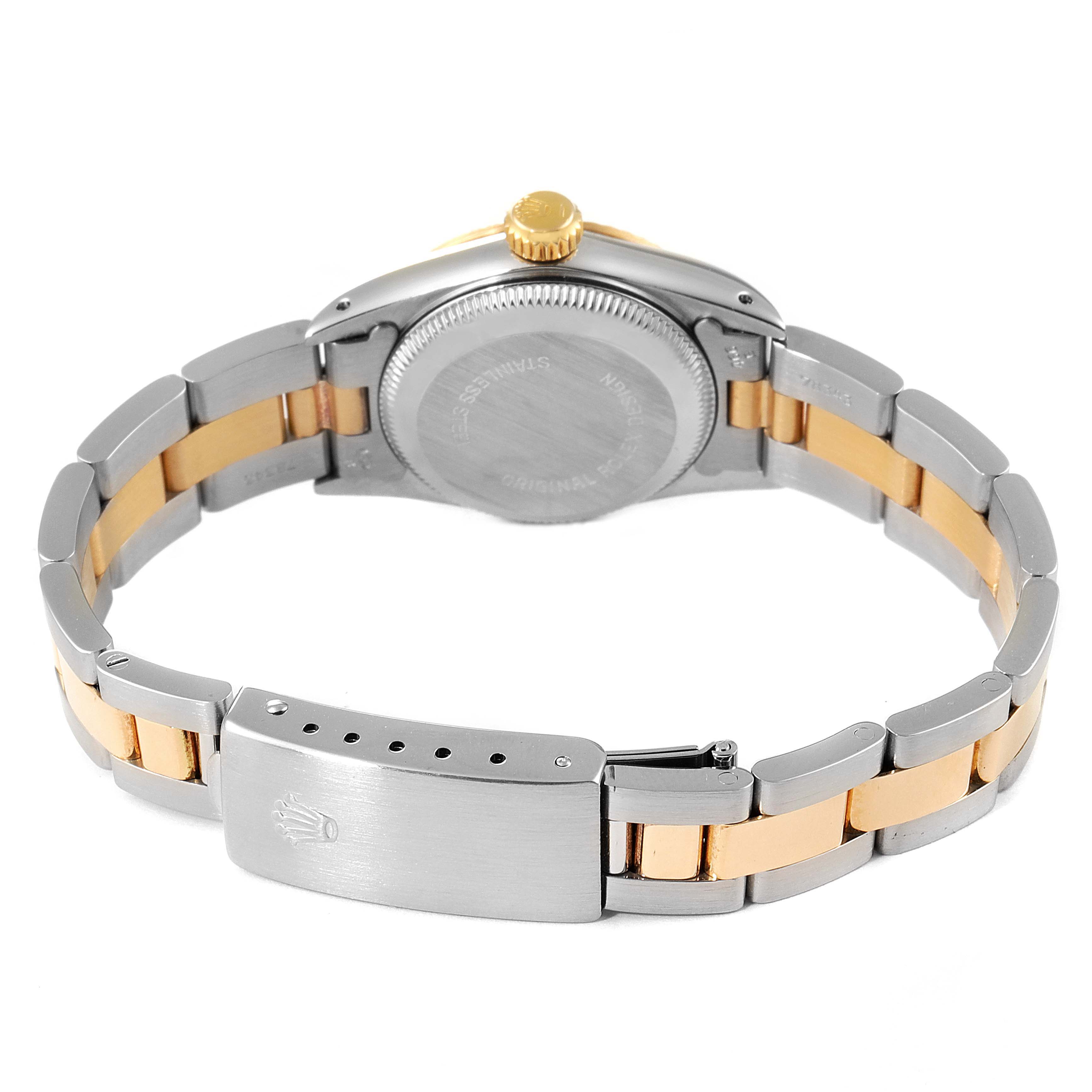 The image shows the back view of a Rolex Oyster Perpetual 67193 Women's Steel and Gold (two tone) Champagne Dial 67193 Women's Steel and Gold (two tone) Champagne Dial watch, highlighting the case back, crown, and two-tone bracelet.
