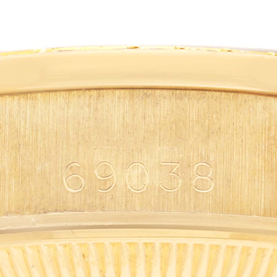 The image shows a close-up of the Rolex Datejust's case or clasp with the engraved model number "69038."