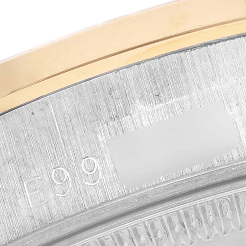The image shows a close-up of the gold and steel bezel and edge of the case of a Rolex President 68289 Women
s White Gold Champagne Dial 68289 Women
s White Gold Champagne Dial watch.