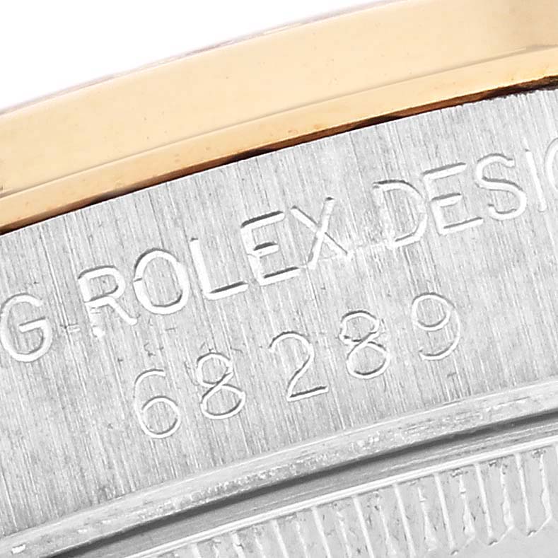 The image shows a close-up of the bezel and case edge with the engraved model number of a Rolex President 68289 Women
s White Gold Champagne Dial 68289 Women
s White Gold Champagne Dial watch.