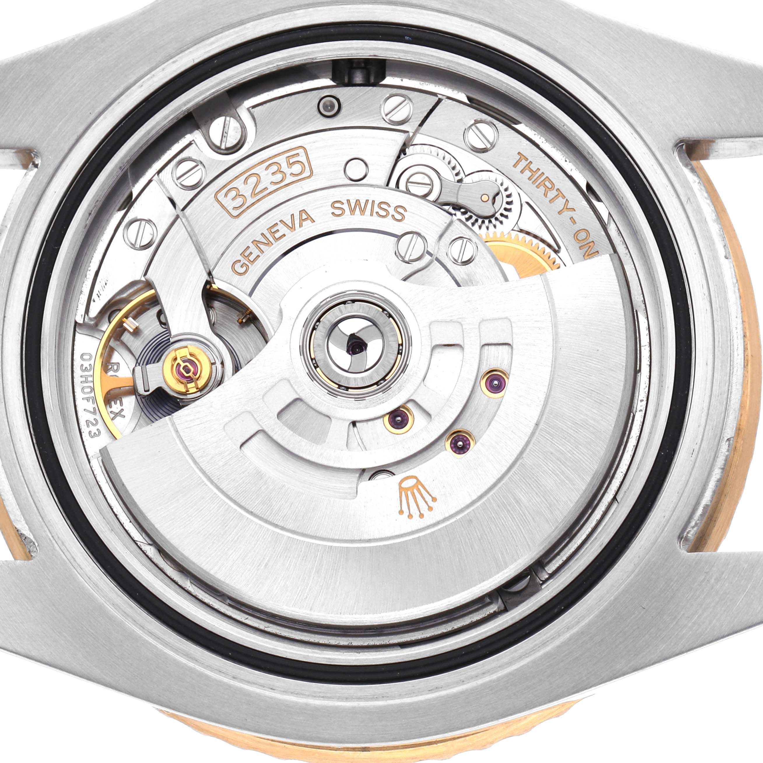 The image shows the movement of a Rolex Submariner 126613 Men's Steel and Gold (two tone) Black Dial watch from the back, highlighting its intricate mechanical components.