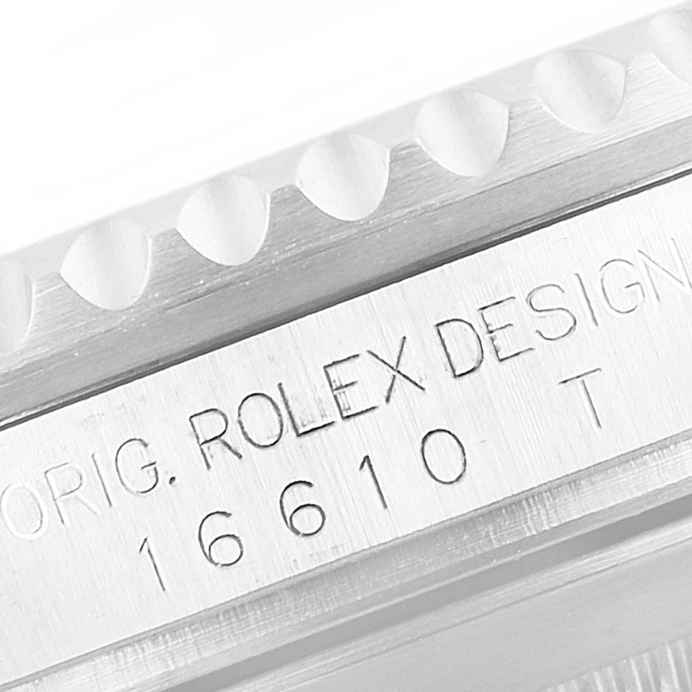 The image shows a close-up of the outer case with the engraved model number for the Rolex Submariner 16610 Men
s Stainless Steel Black Dial 16610 Men
s Stainless Steel Black Dial.