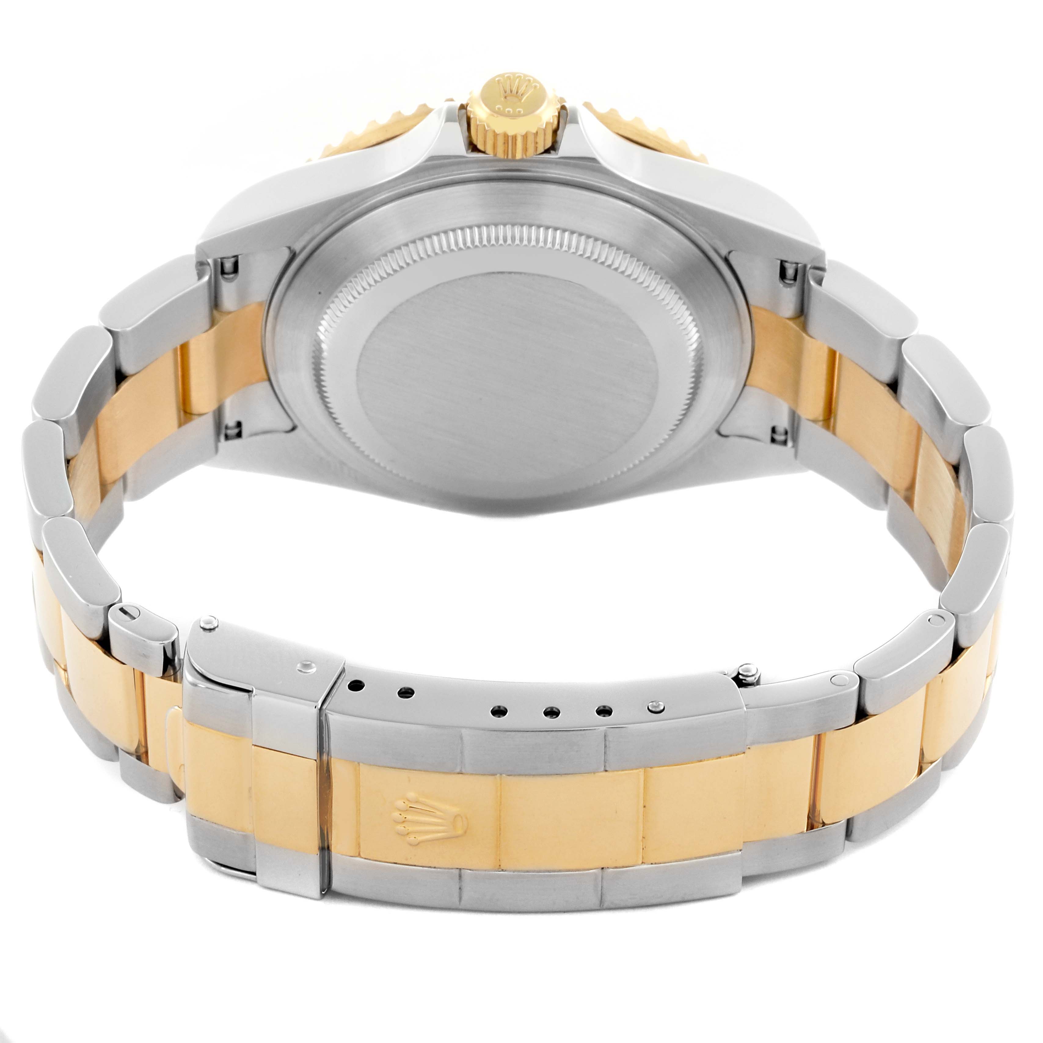 The image shows the back view of a Rolex Submariner 16613 Men's Steel and Gold (two tone) Blue Dial 16613 Men's Steel and Gold (two tone) Blue Dial, highlighting the bracelet, clasp, and case back.