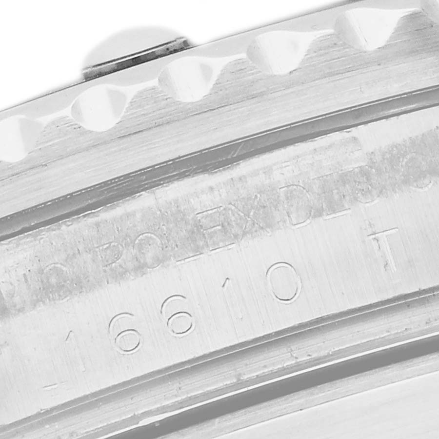 The image shows a close-up of the side engraving on the Rolex Submariner 16610 Men's Stainless Steel Black Dial's bezel and case, highlighting the model number.