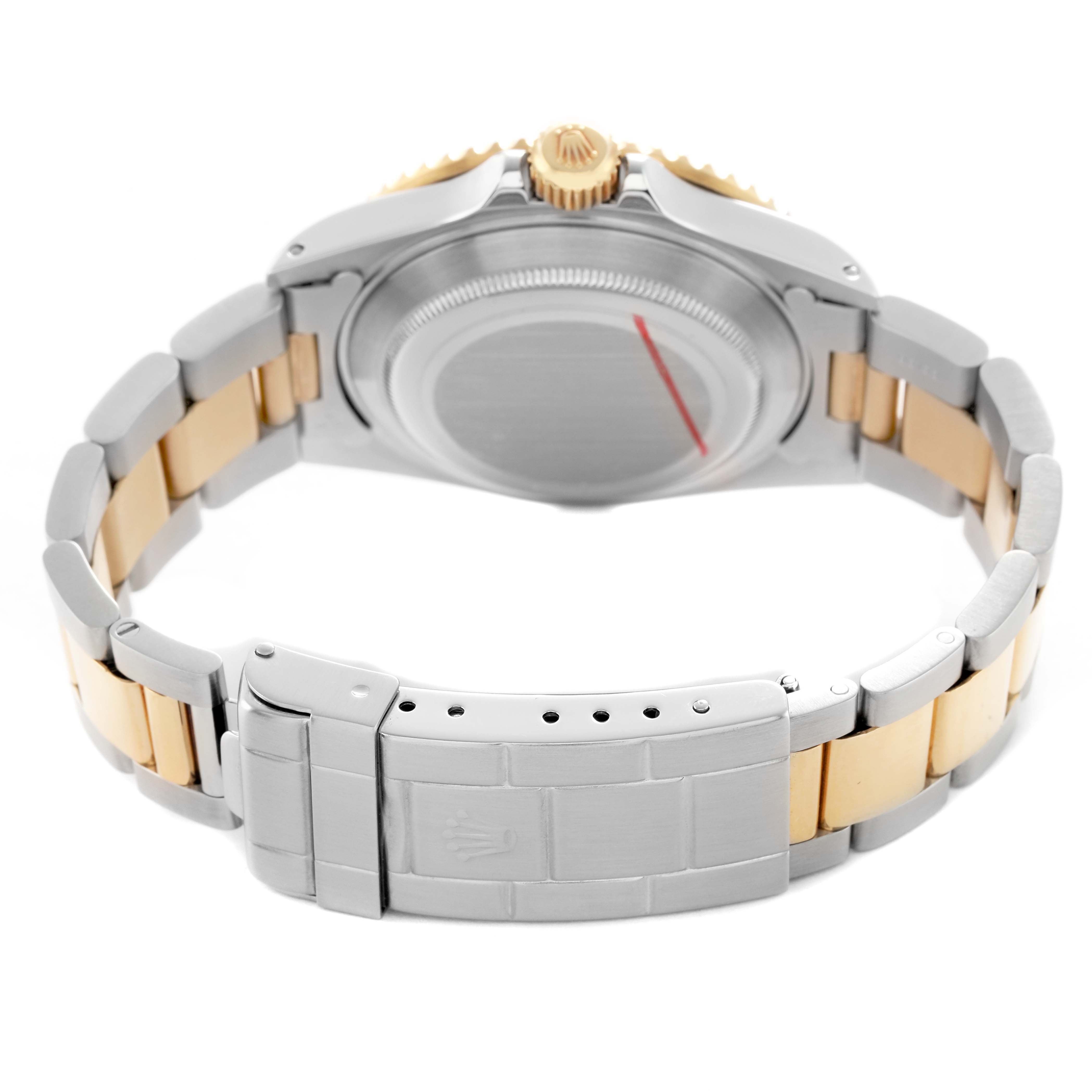 The image shows the back of a Rolex Submariner 16613 Men's Steel and Gold (two tone) Champagne Dial watch, focusing on the clasp, bracelet, and case back.