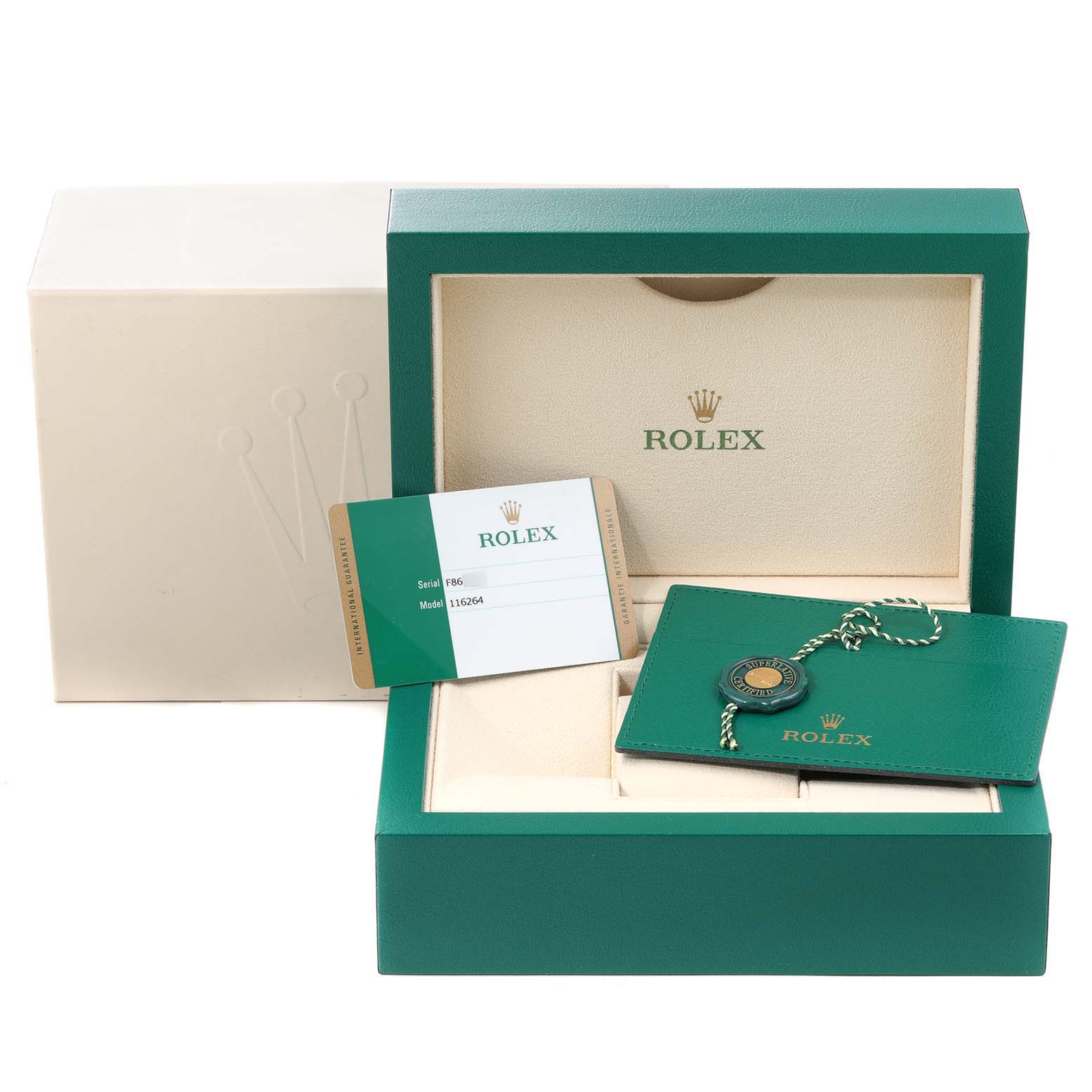 The image shows the packaging and accessories of a Rolex Turn-o-Graph 116264 Men
s Stainless Steel White Dial 116264 Men
s Stainless Steel White Dial, including a box, booklet, card, and tag.