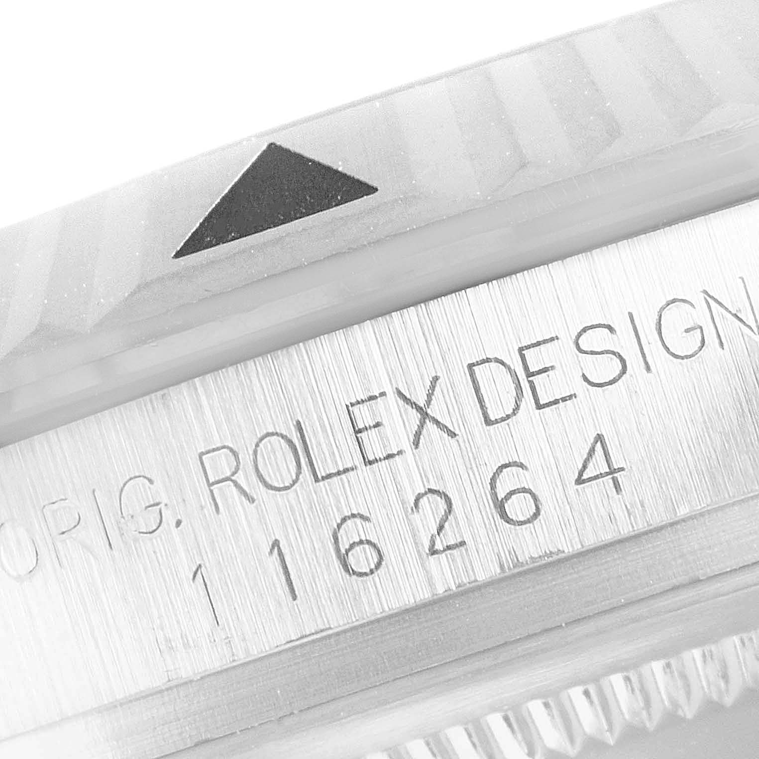 This close-up image of the Rolex Turn-o-Graph 116264 Men
s Stainless Steel White Dial 116264 Men
s Stainless Steel White Dial watch shows the bezel with an engraved triangle and part of the case with the model number 116264.