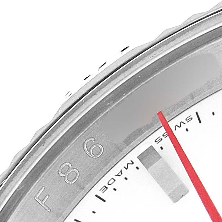 The image shows a close-up of the bezel and part of the dial of a Rolex Turn-o-Graph 116264 Men
s Stainless Steel White Dial 116264 Men
s Stainless Steel White Dial watch.