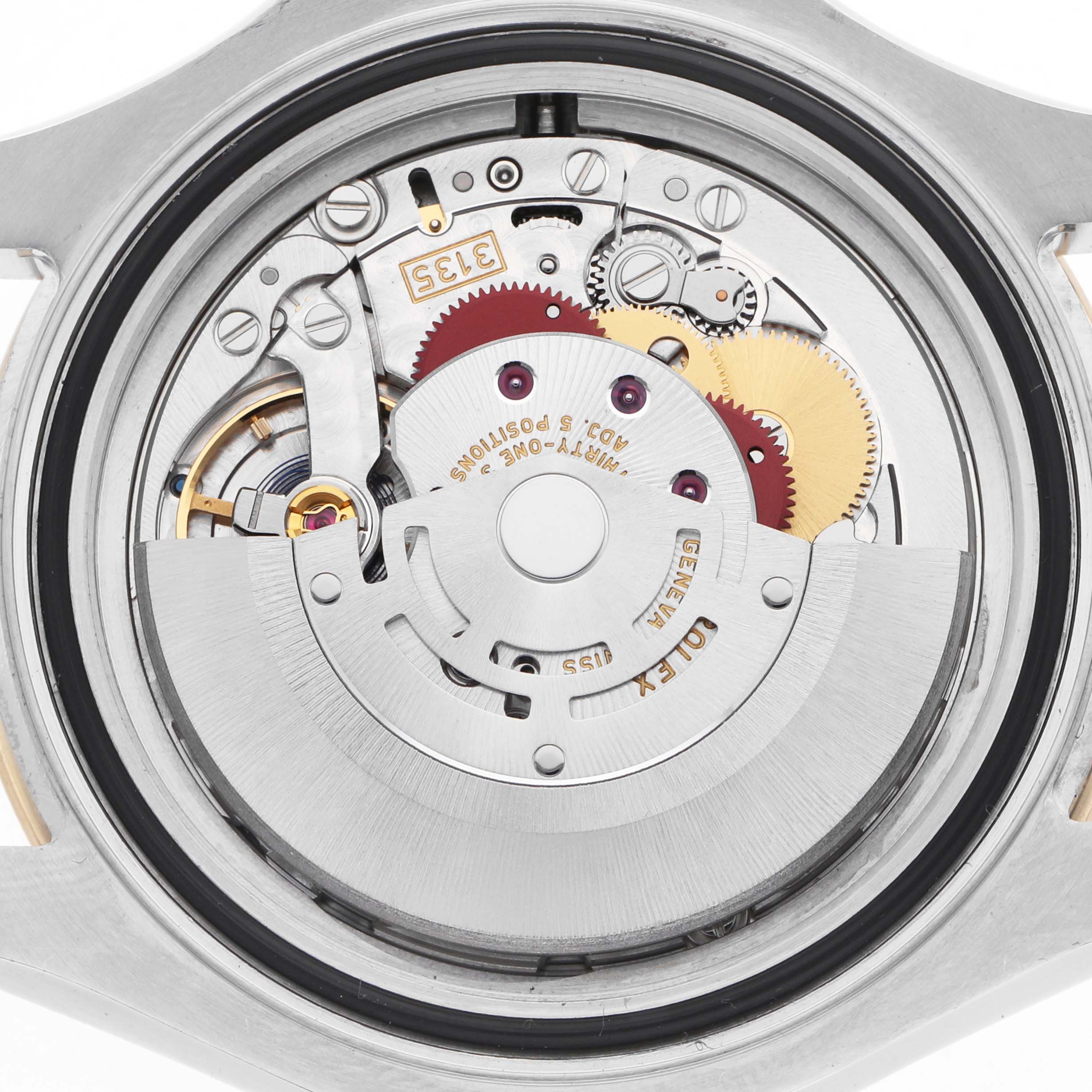 The image shows the internal movement of the Rolex Yacht-Master 16623 Men's Steel and Gold (two tone) Blue Dial watch, focusing on gears and mechanical components.