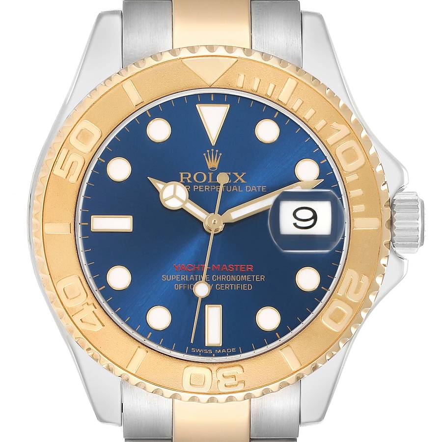 The Rolex Yacht-Master 16623 Men's Steel and Gold (two tone) Blue Dial watch is shown from a top-down angle, highlighting its blue dial, gold bezel, and bracelet detail.