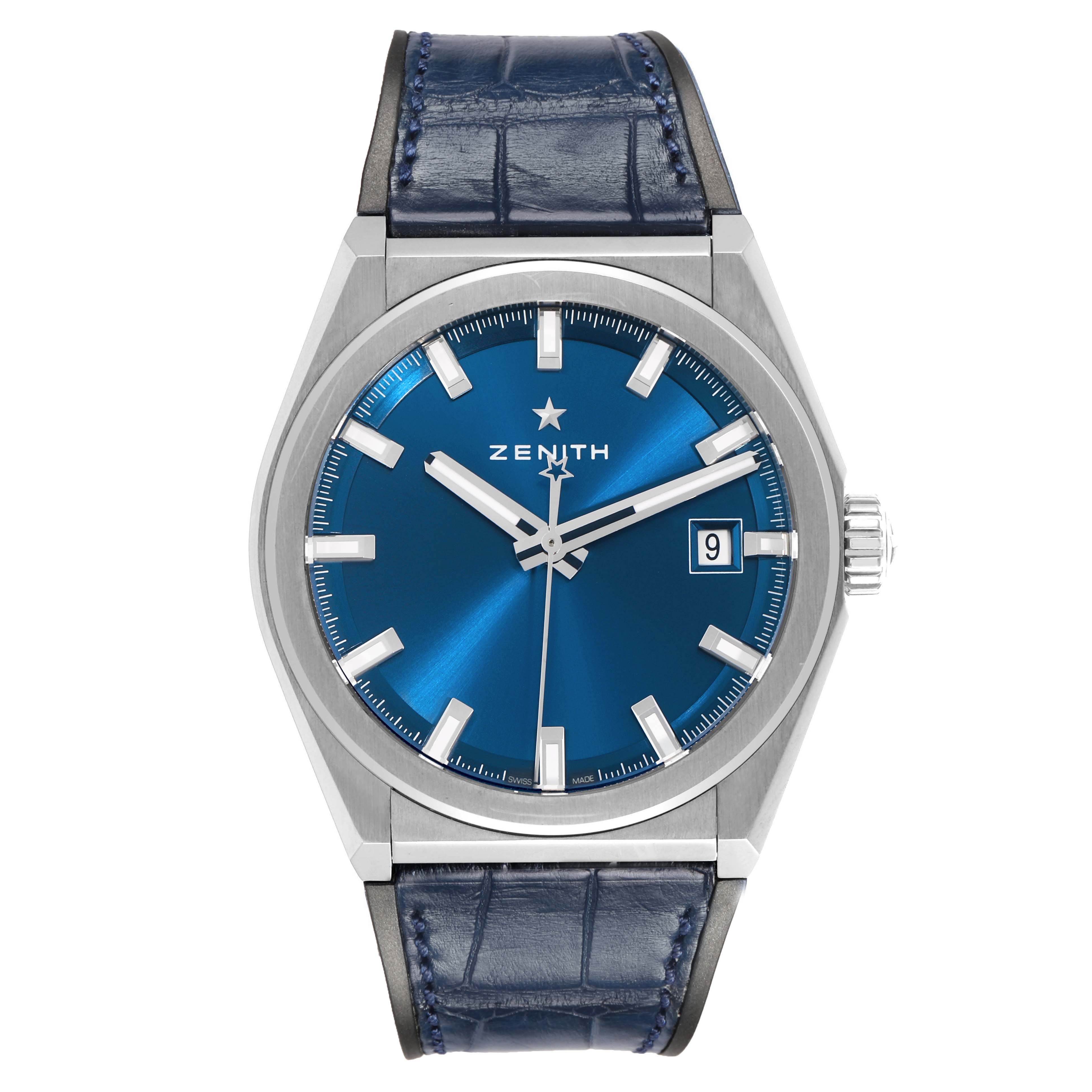The Zenith Defy 95.9000.670/51 Men's Titanium Blue Dial watch is shown from a front view, displaying the dial, hands, markers, case, crown, and blue leather strap.