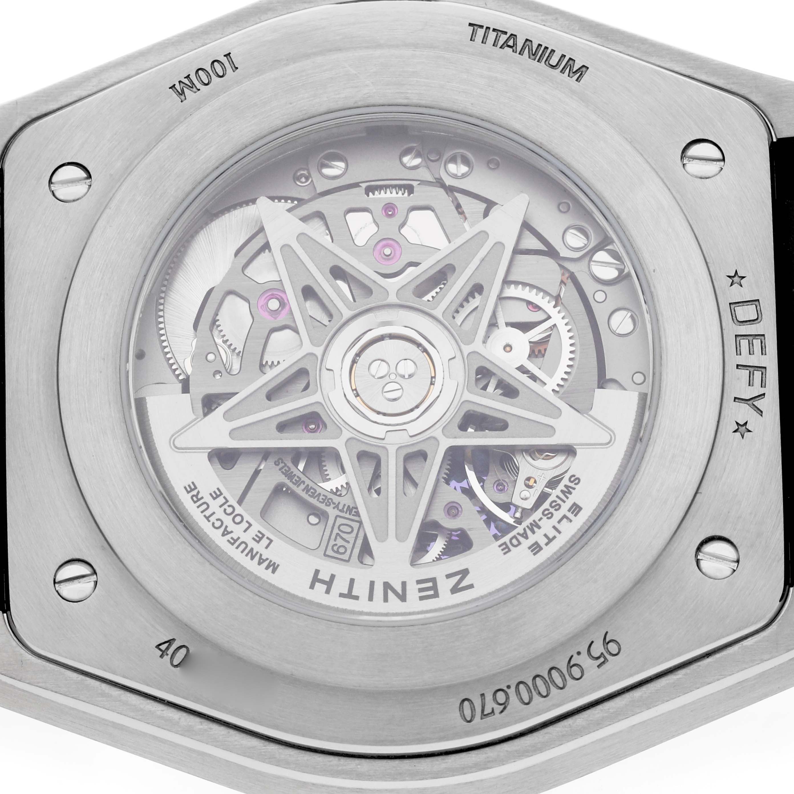 The image shows the back of a Zenith Defy 95.9000.670/51 Men's Titanium Blue Dial watch, highlighting its titanium case and visible movement.