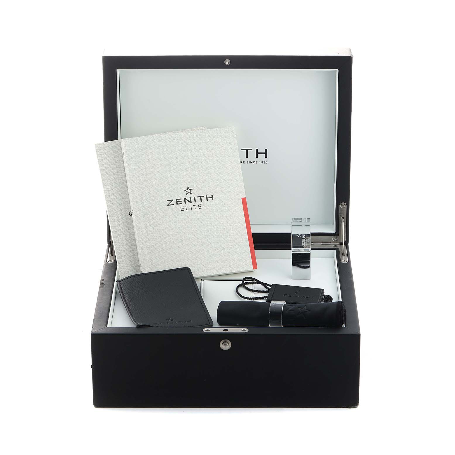 The image shows a Zenith Defy 95.9000.670/51 Men's Titanium Blue Dial watch box with manuals, a leather pouch, a strap, and a lens cloth inside.