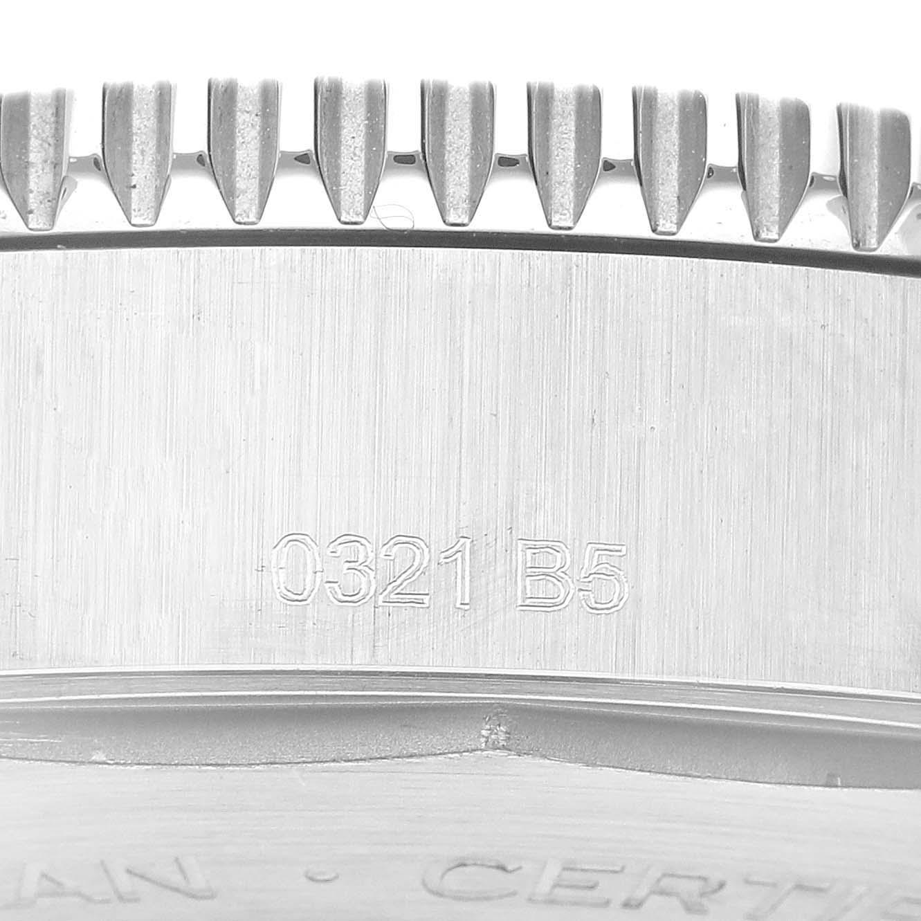The image shows a close-up of the side of the bezel of a Breitling Superocean A17366 Men's Stainless Steel White Dial A17366 Men's Stainless Steel White Dial watch with some engraved numbers.
