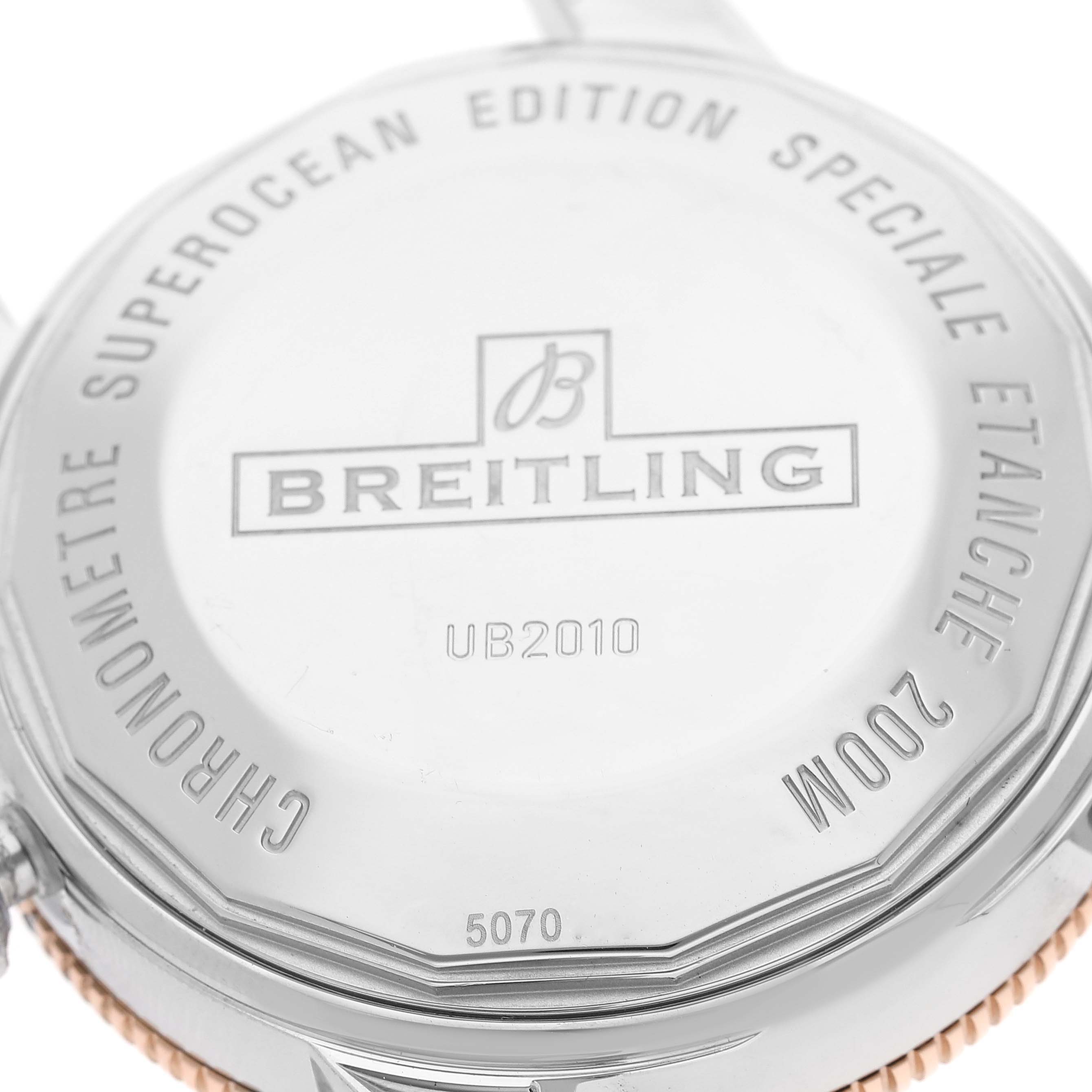 The image shows the back of a Breitling Superocean UB2010121B1S1 Men's Steel and Gold (two tone) Black Dial UB2010121B1S1 Men's Steel and Gold (two tone) Black Dial watch, highlighting the engraved branding and model details.