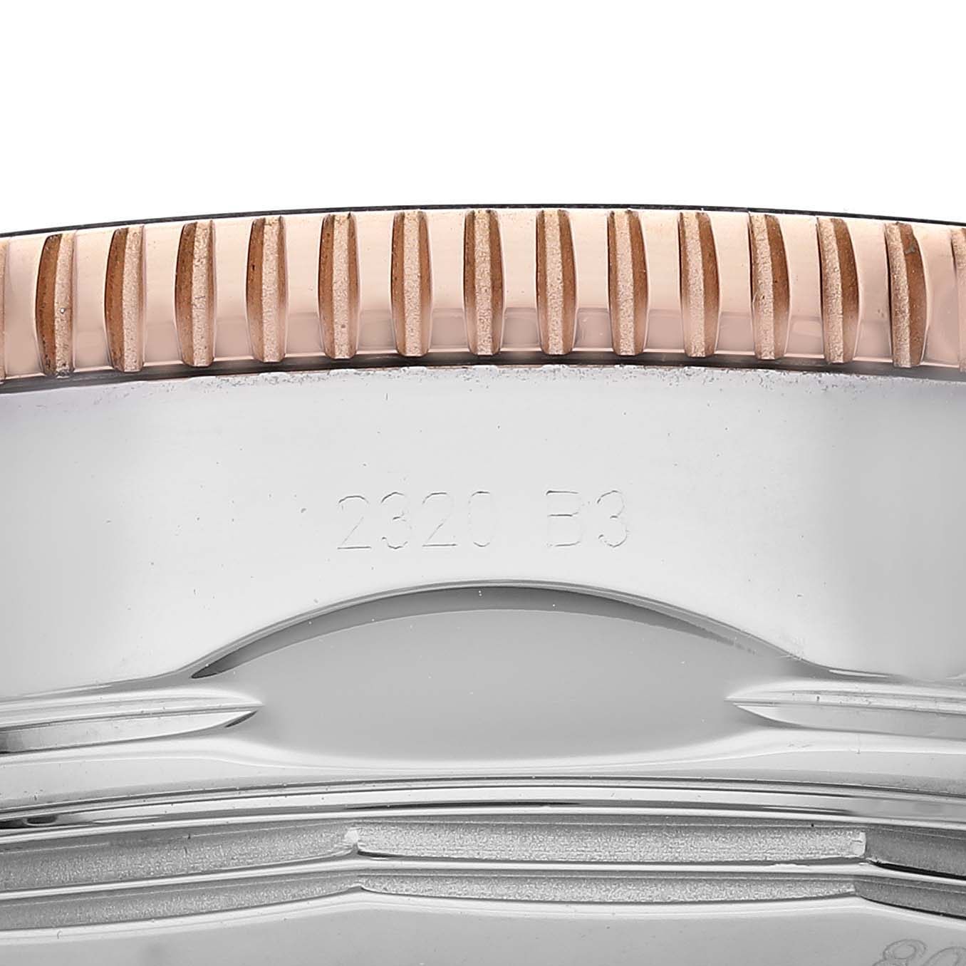 This image shows a close-up of the side view of the bezel and case of a Breitling Superocean UB2010121B1S1 Men's Steel and Gold (two tone) Black Dial UB2010121B1S1 Men's Steel and Gold (two tone) Black Dial watch.