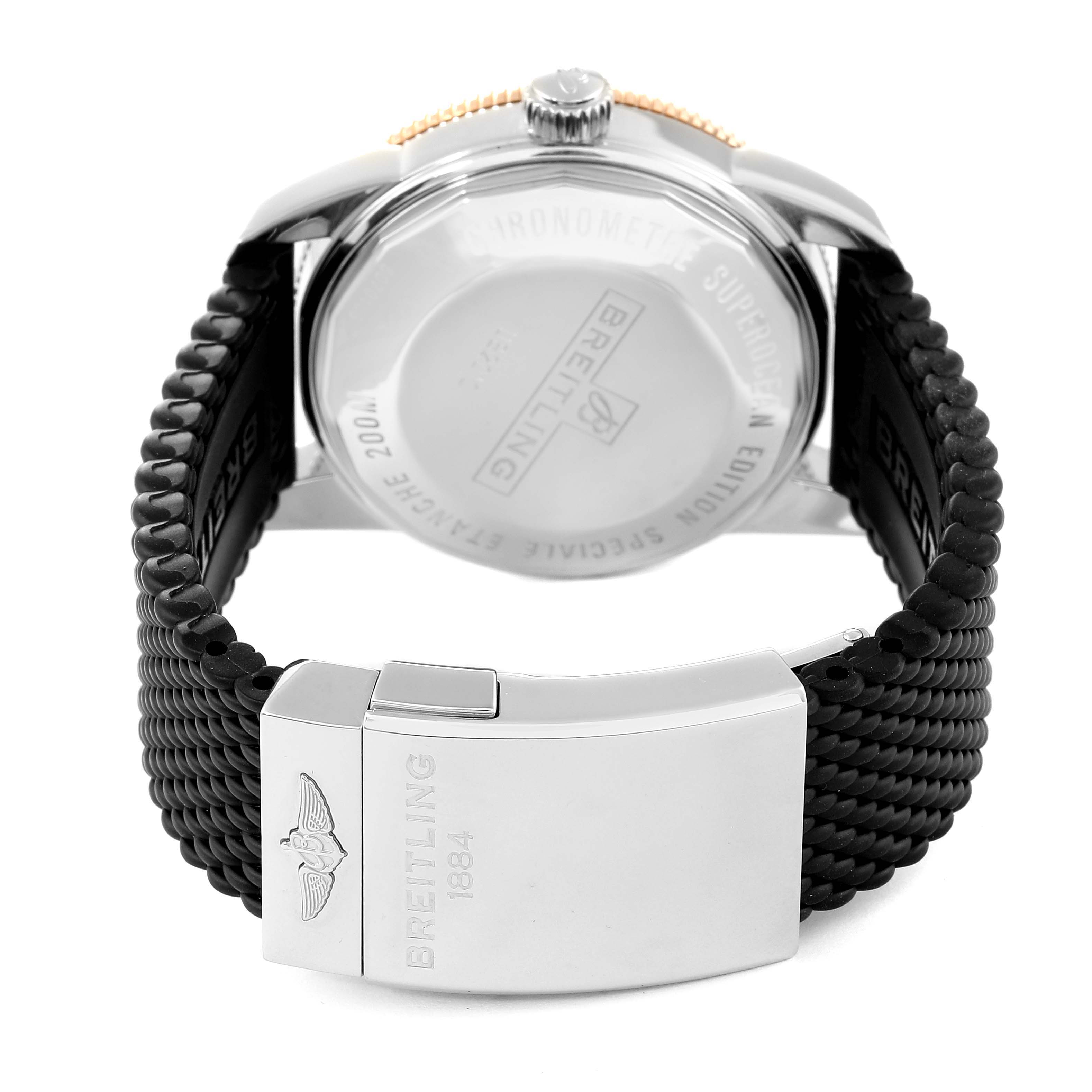 The image shows the back view of a Breitling Superocean UB2010121B1S1 Men's Steel and Gold (two tone) Black Dial UB2010121B1S1 Men's Steel and Gold (two tone) Black Dial model watch with a focus on the stainless steel clasp and rubber strap.