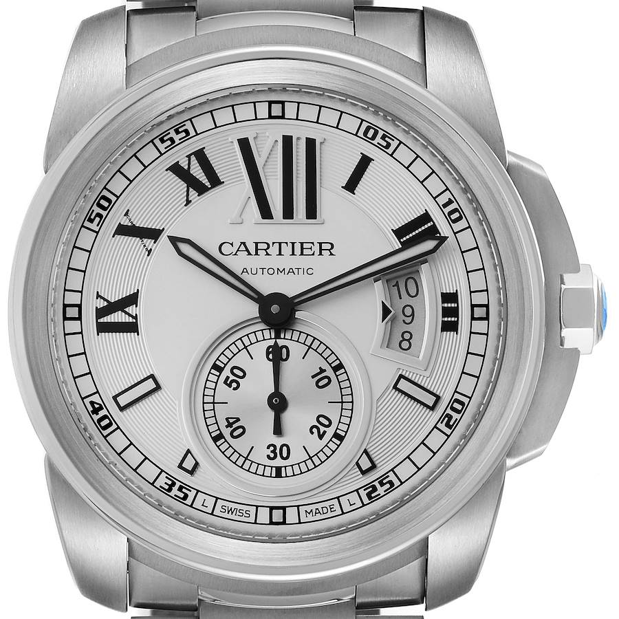 The image shows a full frontal view of the Calibre de Cartier watch, highlighting its dial, hands, and date indicator.