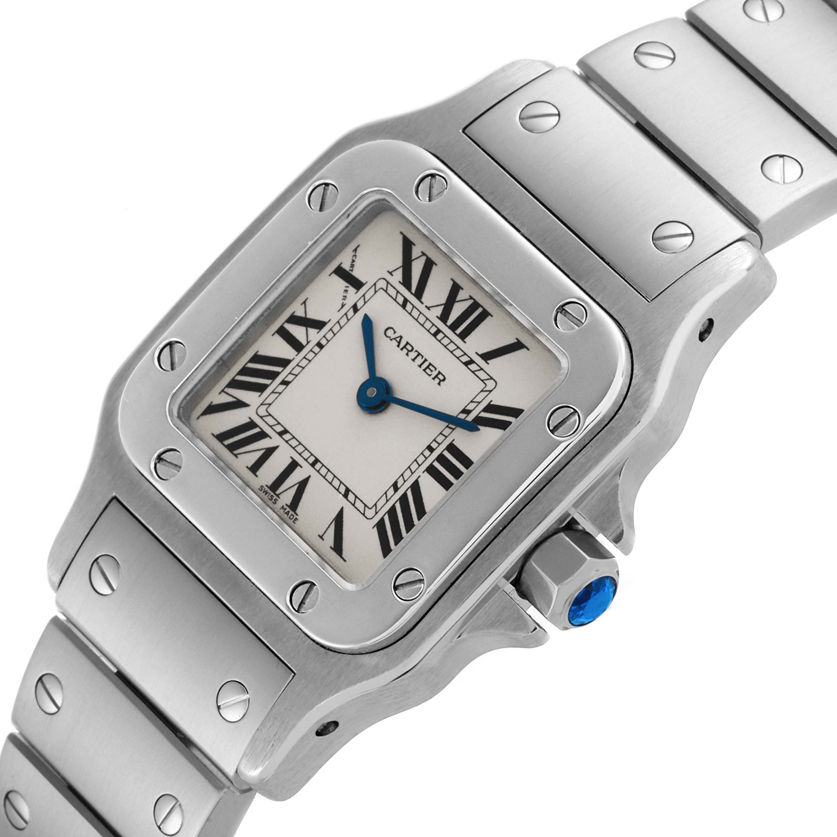 The Cartier Santos W20056D6 Women's Stainless Steel Silver Dial W20056D6 Women's Stainless Steel Silver Dial watch is shown at an angled close-up, highlighting its face, bezel, and part of the bracelet.