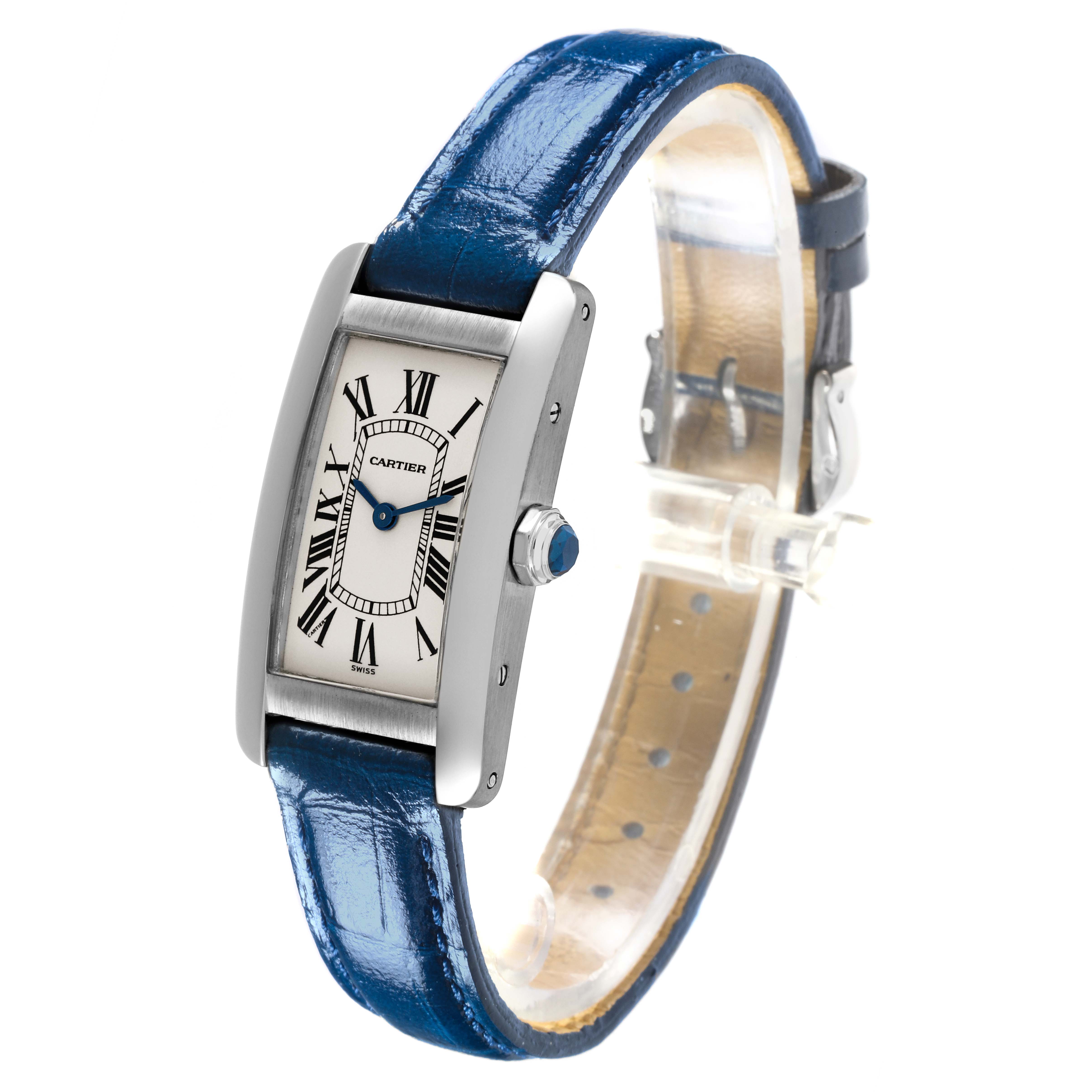 The Cartier Tank Americaine W2601956 Women's White Gold Silver Dial W2601956 Women's White Gold Silver Dial watch is shown at a slight angle, displaying its face, crown, and blue leather strap.
