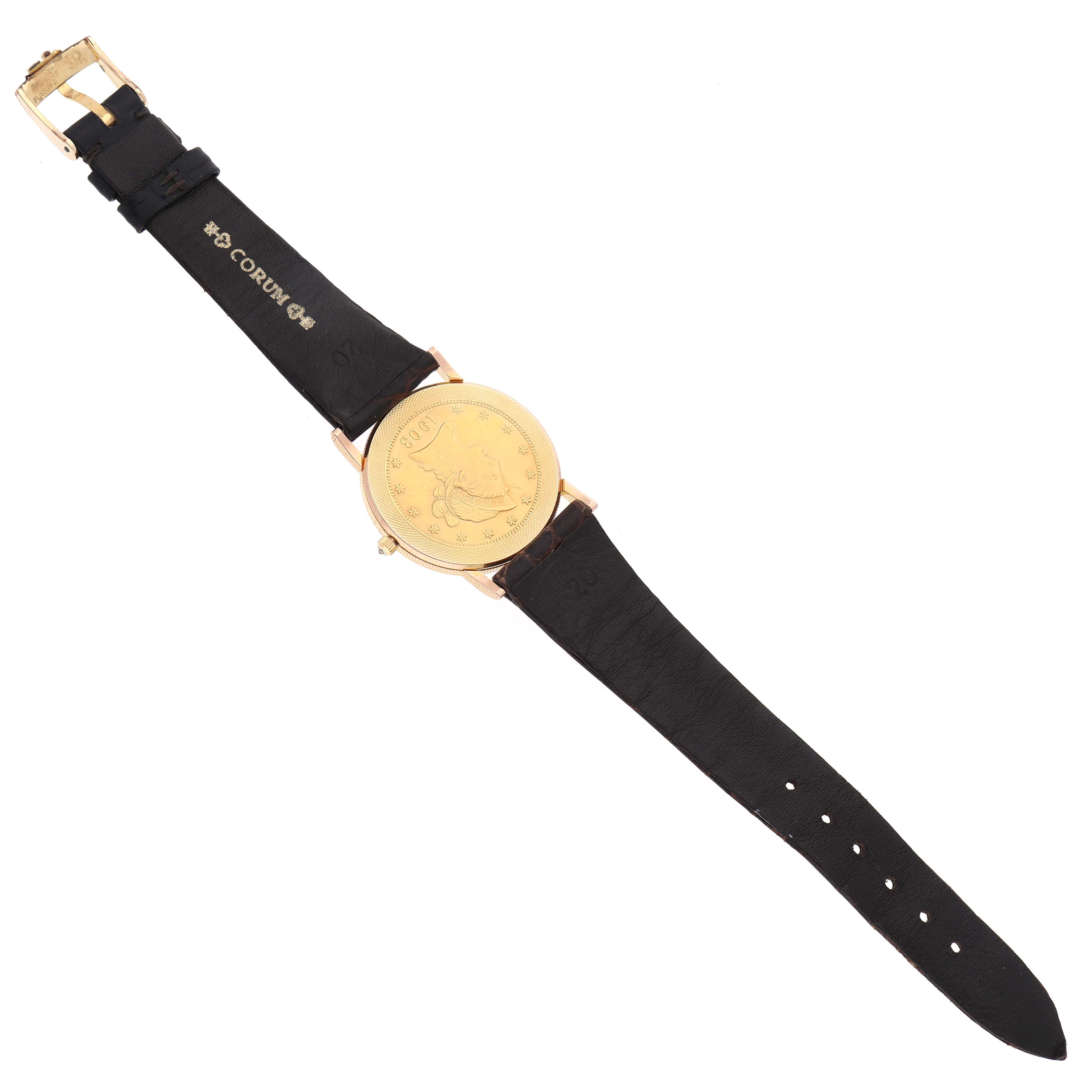 The Corum Coin Watch 1903 Men's Yellow Gold Yellow Dial 1903 Men's Yellow Gold Yellow Dial is shown from a top-down angle, displaying its face and full black strap.