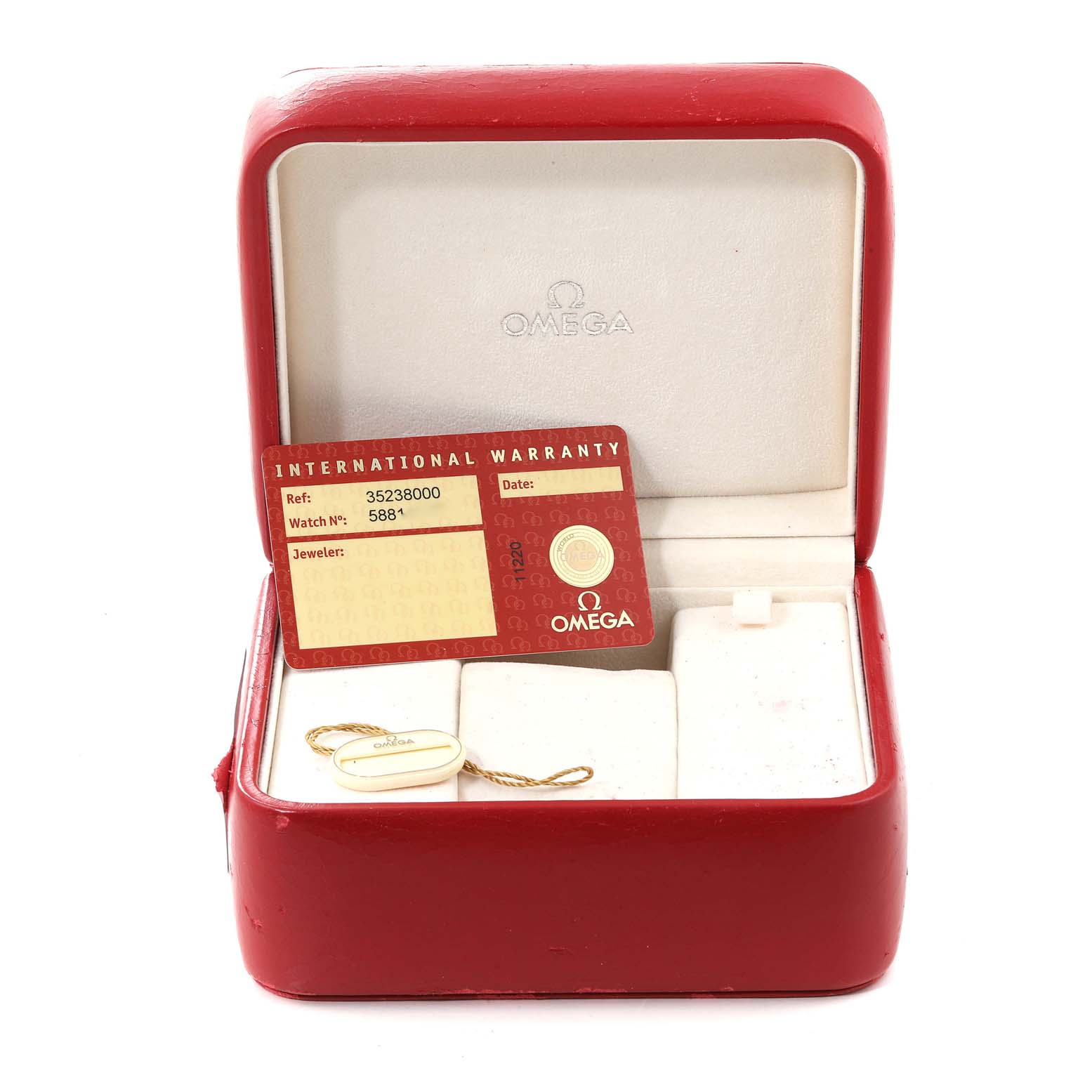 The image shows the open box of an Omega Speedmaster 3523.80.00 Men
s Stainless Steel Blue Dial 3523.80.00 Men
s Stainless Steel Blue Dial watch, including an international warranty card and a tag.